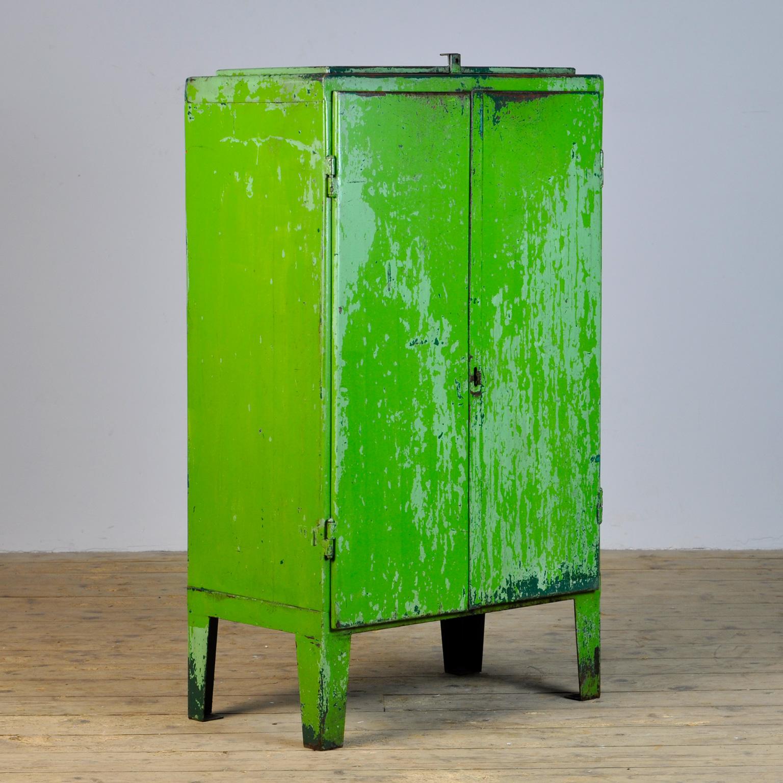 Iron industrial sideboard in vintage condition. Made of metal. With on top of a valve. Two shelves and two drawers on the inside. Treated for rust and finished with a transparent varnish. The surface is smooth and clean.