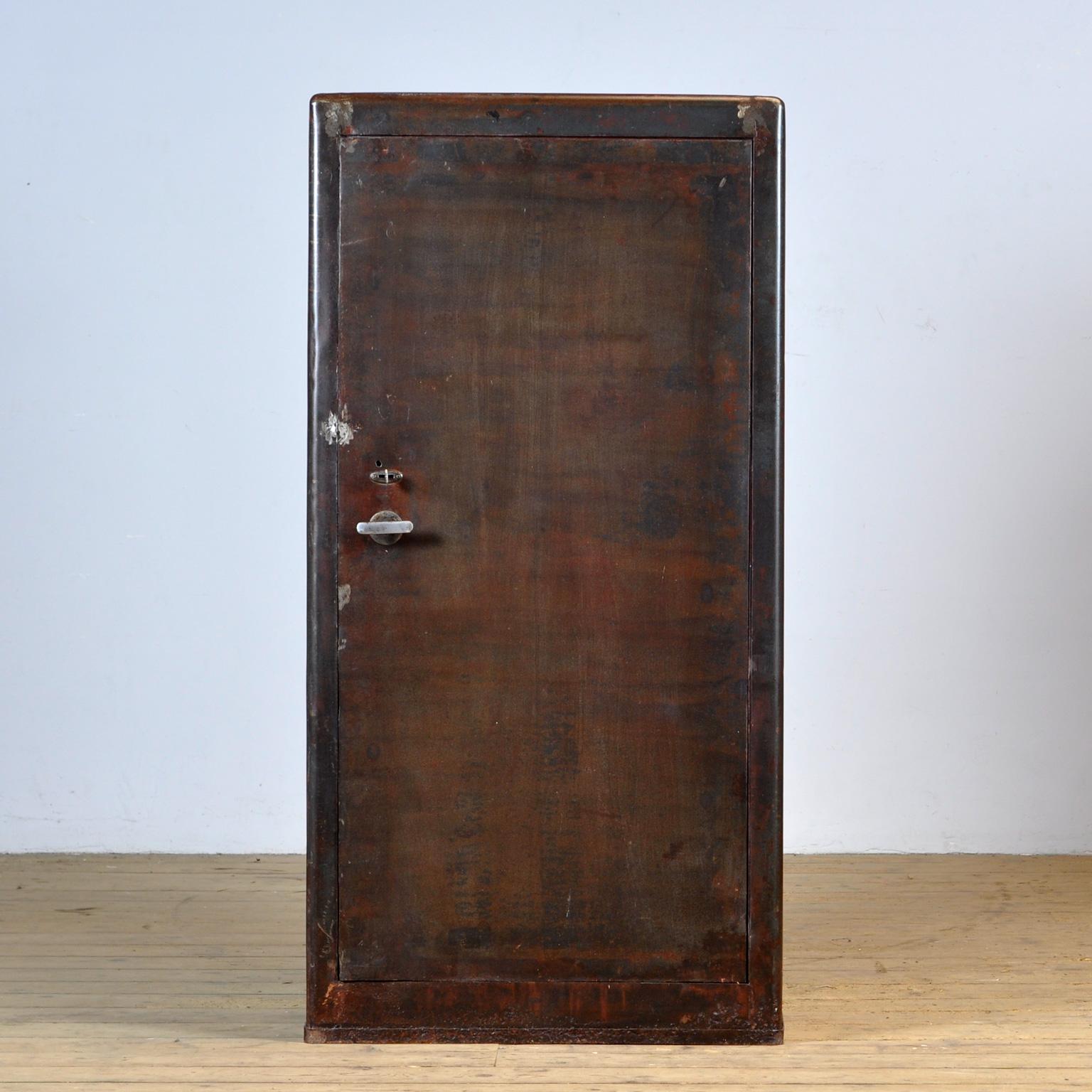 Industrial cabinet from the 1960s, made of metal with 3 adjustable shelves on the inside. The cabinet has been treated against rust and finished with transparent lacquer. The surface is smooth and clean. With well-functioning lock/key. Heavy