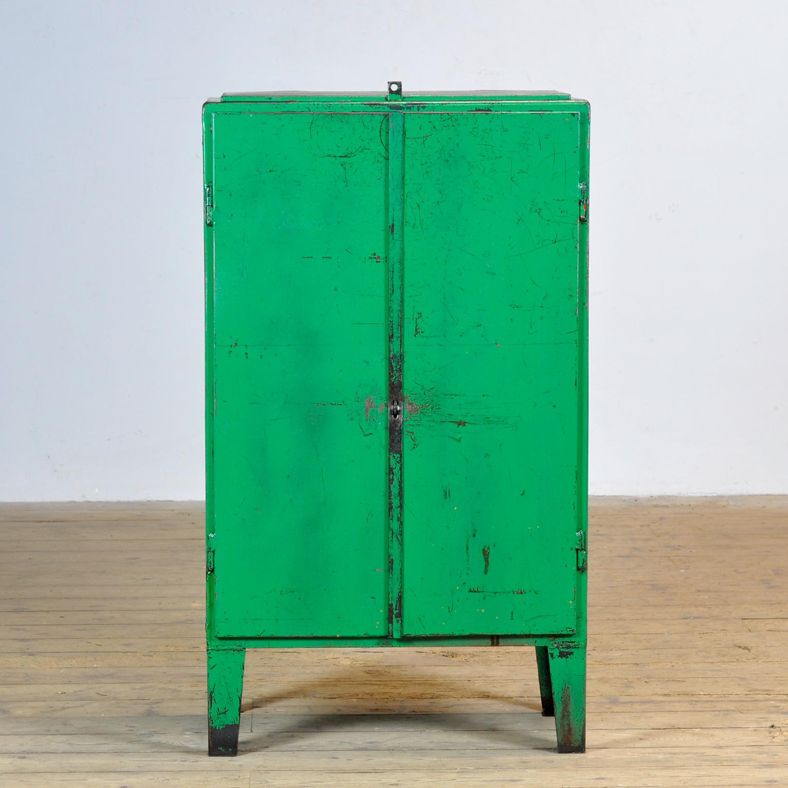 Iron industrial sideboard from the 1960’s with a valve on top. One shelve and two drawers on the inside. Treated with rust-preventing oil. The surface is smooth and clean.