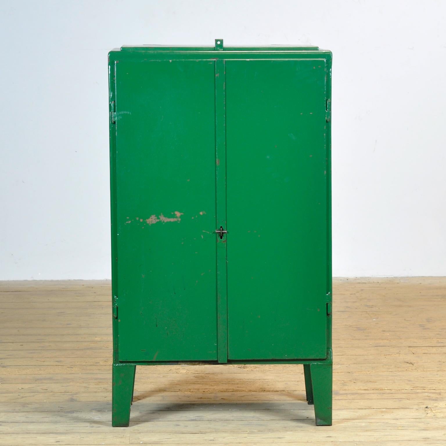 Iron industrial sideboard from the 1960’s with a valve on top. One shelve and two drawers on the inside. Treated with rust-preventing oil. The surface is smooth and clean.