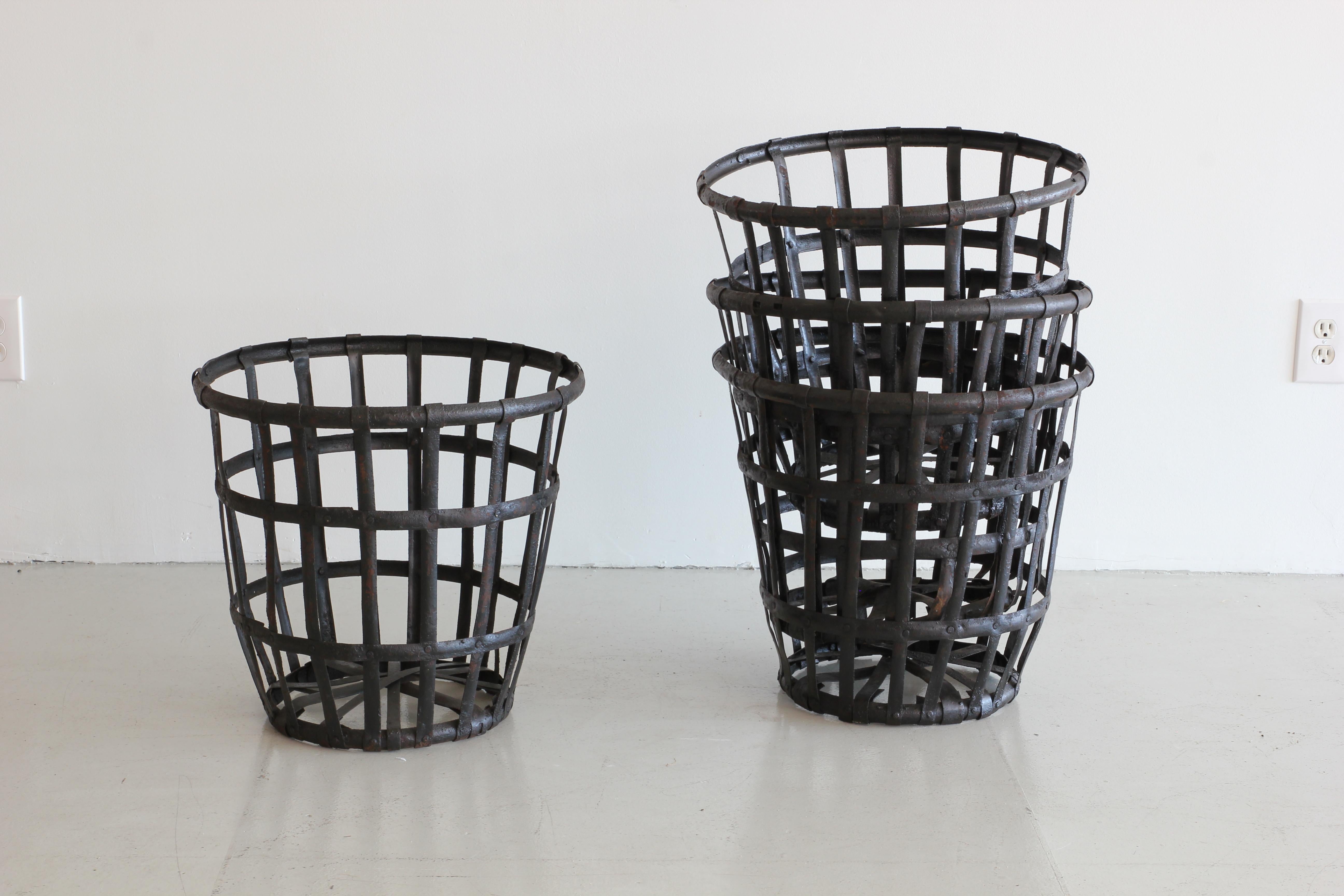 Excellent cage style baskets in black iron with heavy patina. Sold individually. Five available.
