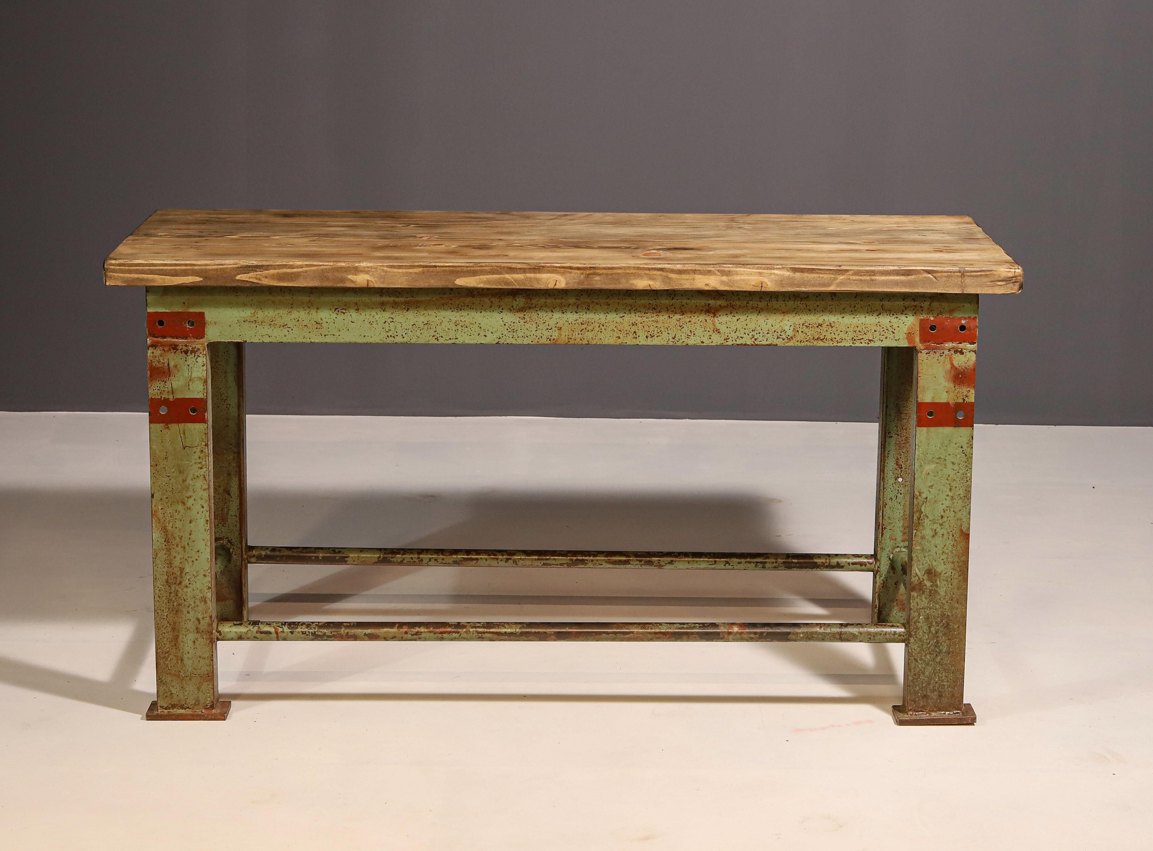 This industrial kitchen table was made in the former Czechoslovakia in the 1950´s

It was originally used as a work table for craftsmen. It´s made of iron with a wooden table top.

The table is overall in good vintage condition, it shows signs of