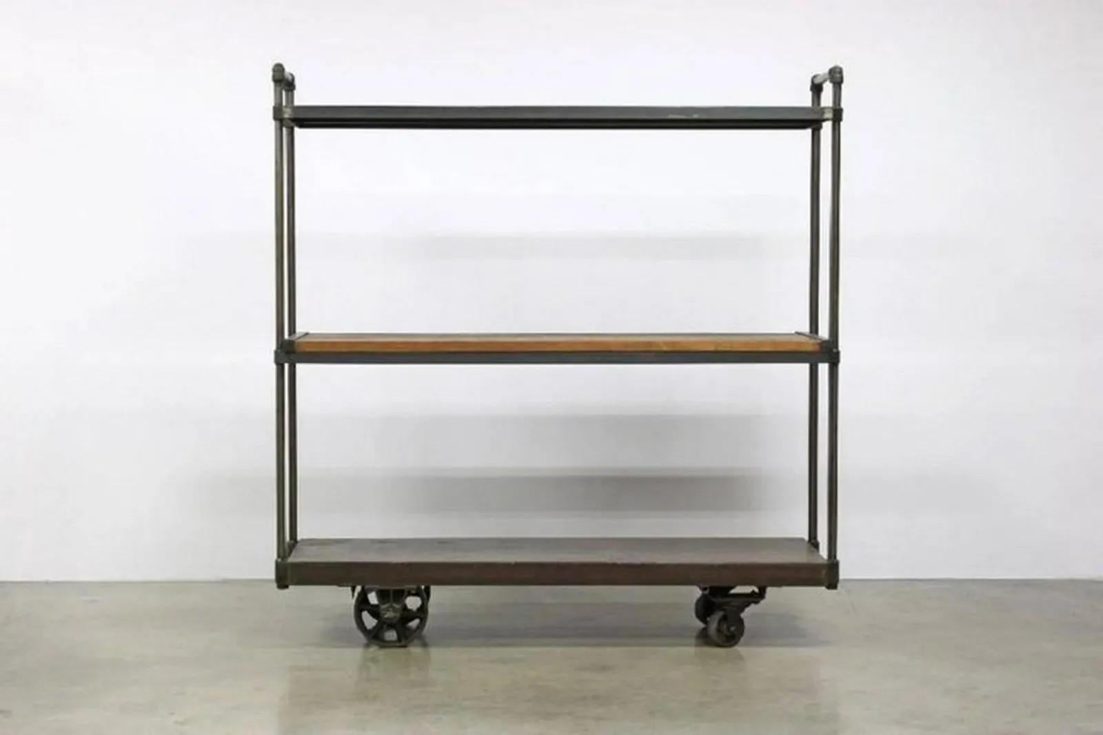 Large triple shelf for clothing storage or store display. Made from iron and reclaimed wood. Measure: Height 78 inches, depth 25inches, width 76 inches.