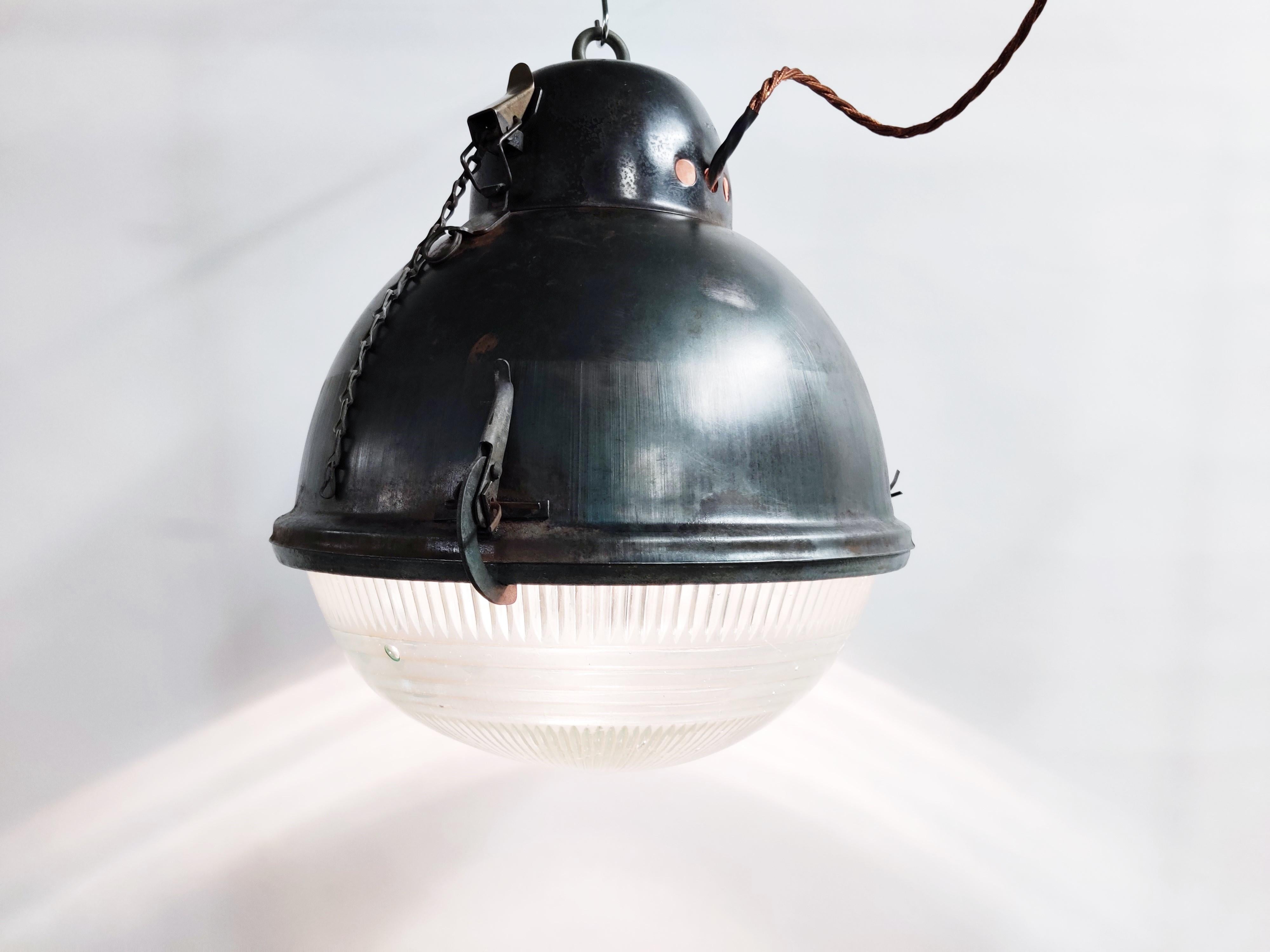 Industrial 'ball' lamps with prismatic glass. They would have been used as street lamps.
 
These Industrial lamps give a beautiful light thanks to the prismatic glass.

The lamps have a nice Industrial look and would be a lovely contrast for a