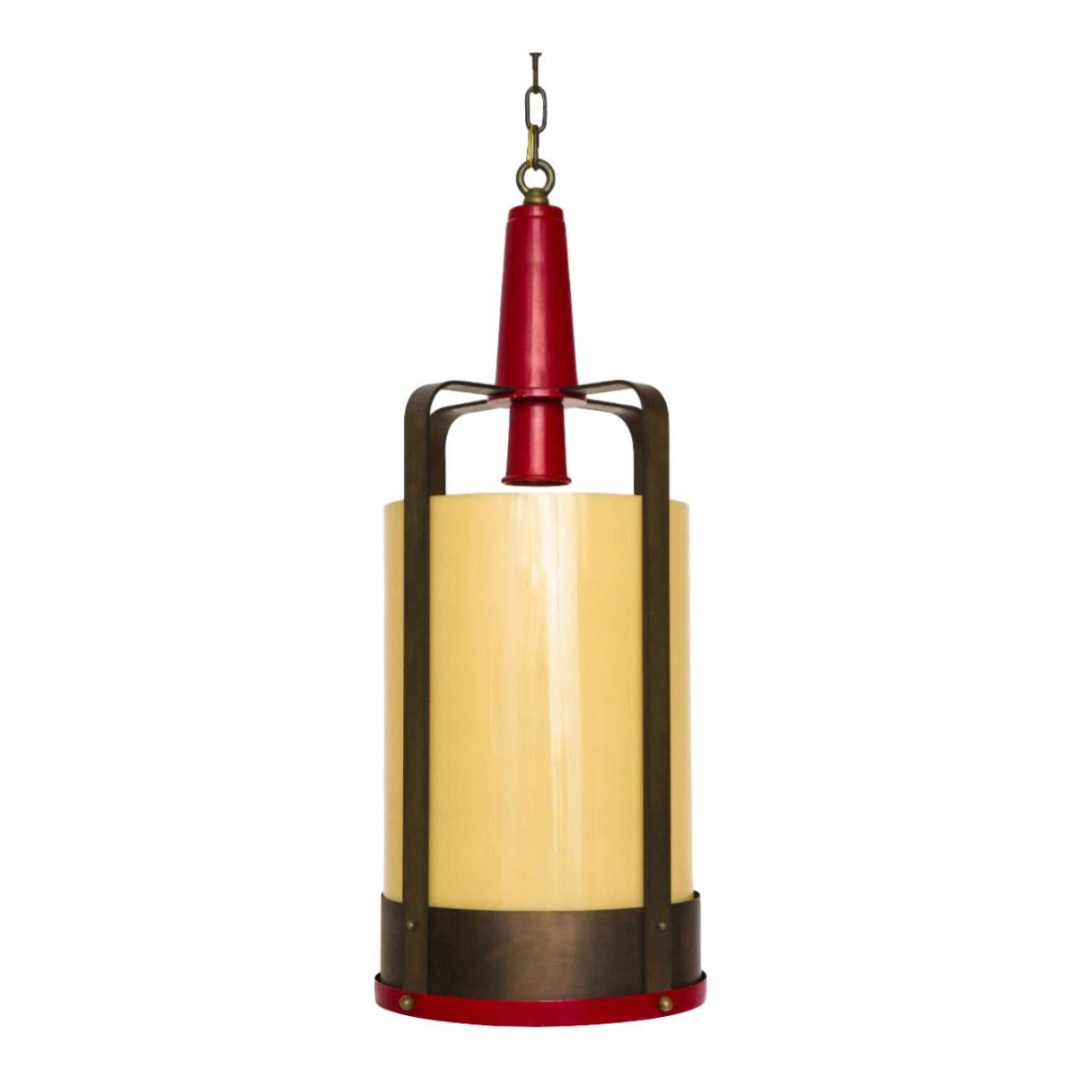 Large industrial style lantern style pendants with amber glass diffusers.