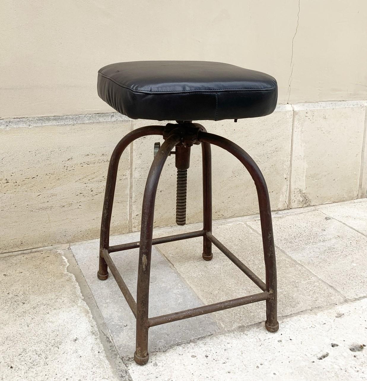 Industrial leather and iron swivel stool from the 1930-1940's. The maximum height is 75 cm or 29,5 inches. The leather is old reupholstery which is in great condition. Subtle patina and very comfortable. The iron has a faded old paint