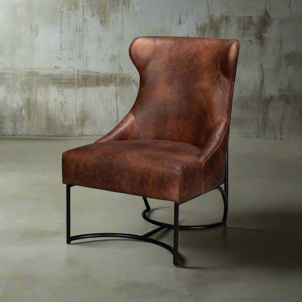 Featuring a sleek iron frame, this chair provides both sturdiness and a contemporary flair. The rich brown leather upholstery exudes sophistication and luxury, ensuring a comfortable and inviting seating experience.

The high backrest and gracefully