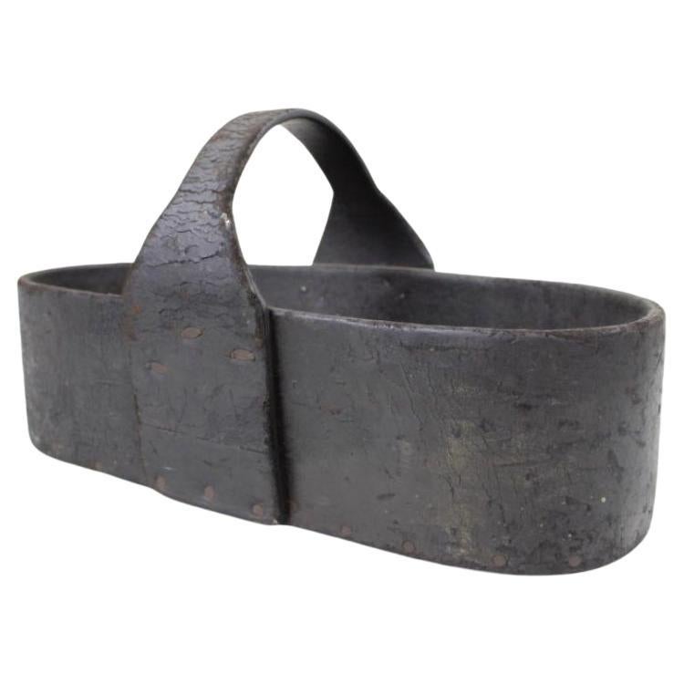 Handmade industrial leather tool caddy with wooden bottom. This chic industrial form is had made from thick oiled leather, with a wooden base. 
This would be great as a drinks carrier. 
France, 1920's.