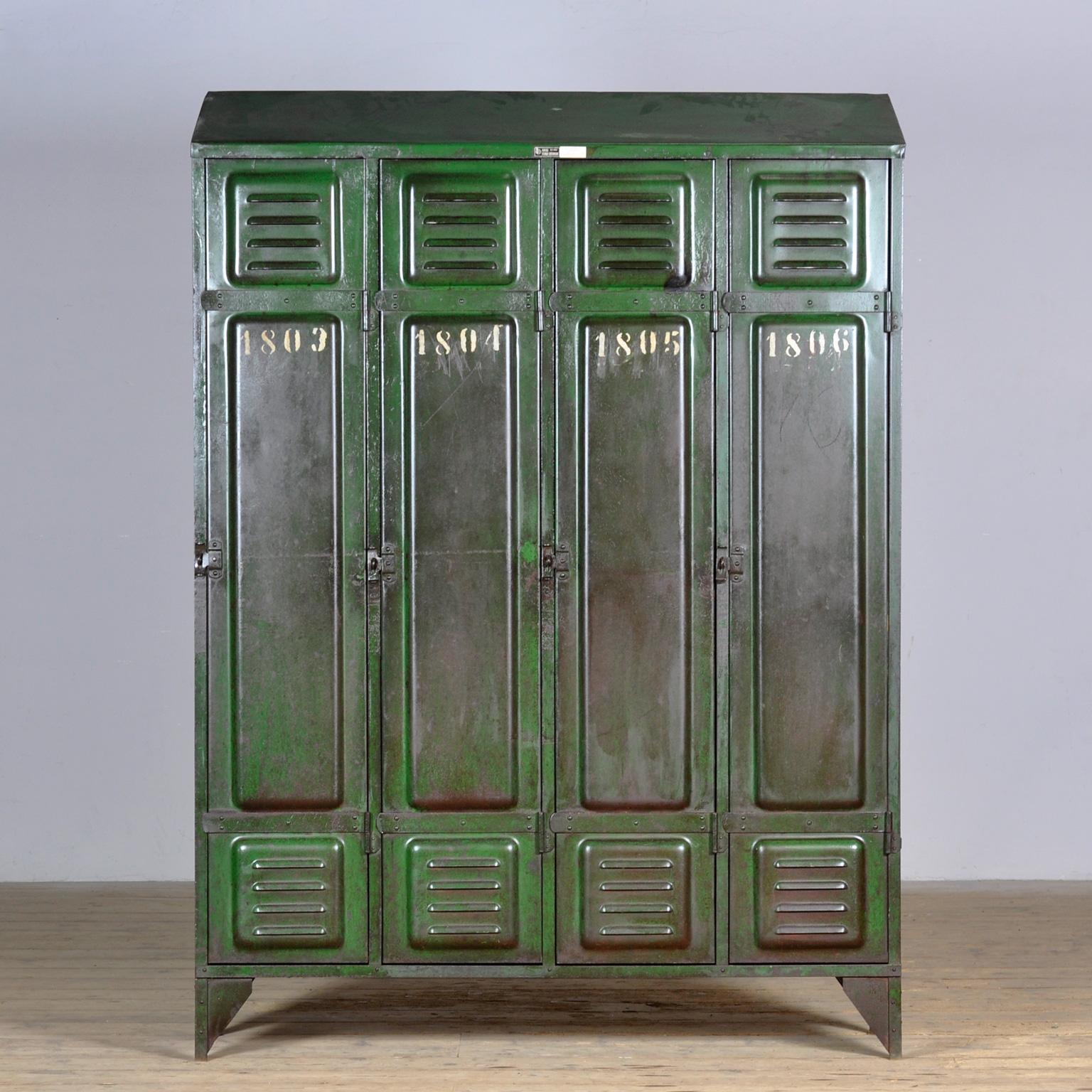 This locker was made in France around 1940 and has four compartments to store all your belongings. In the upper part a shelf and in the lower part clothes hooks. The locker has a green color that fits with any style. The locker has a rustic and