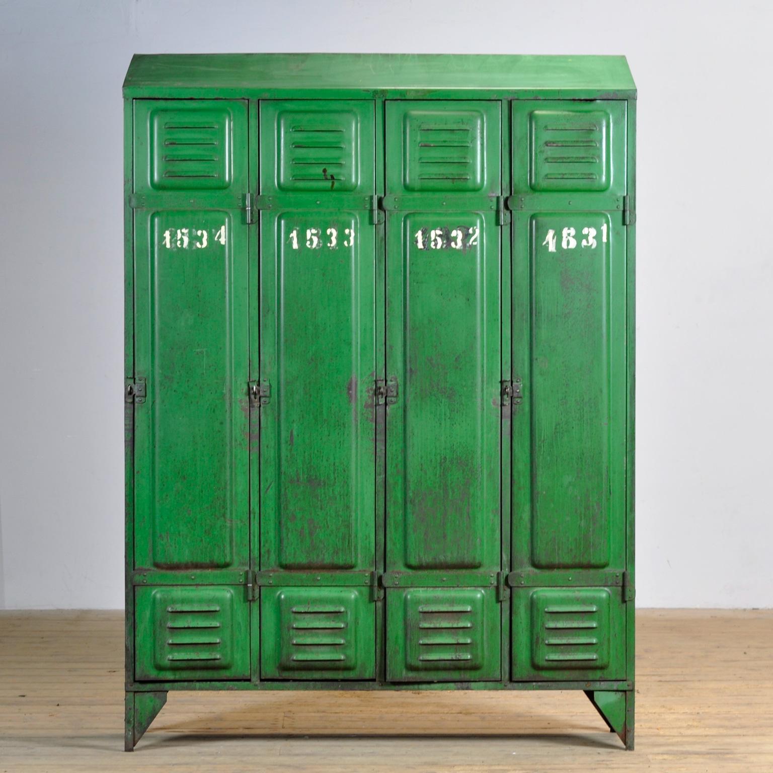 This locker was made in France around 1940 and has four compartments to store all your belongings. In the upper part a shelf and in the lower part clothes hooks. The locker has a green color that fits with any style. The locker has a rustic and