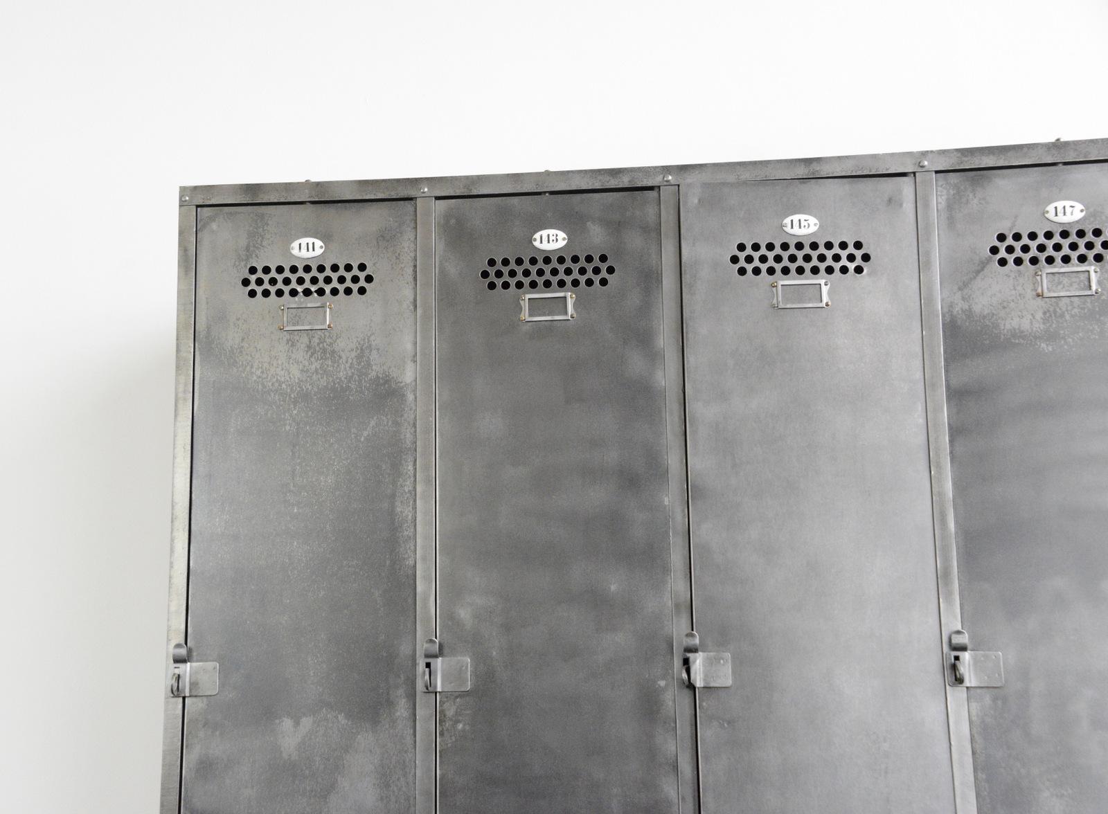 Industrial Lockers by Otto Bruckner circa 1930s

- Vented steel doors
- 4 compartments with hanging space and shelves
- Slide in doors
- Porcelain door numbers
- Made by Otto Bruckner, Chemnitz
- German ~ 1930s
- Measures: 183cm tall x 143cm