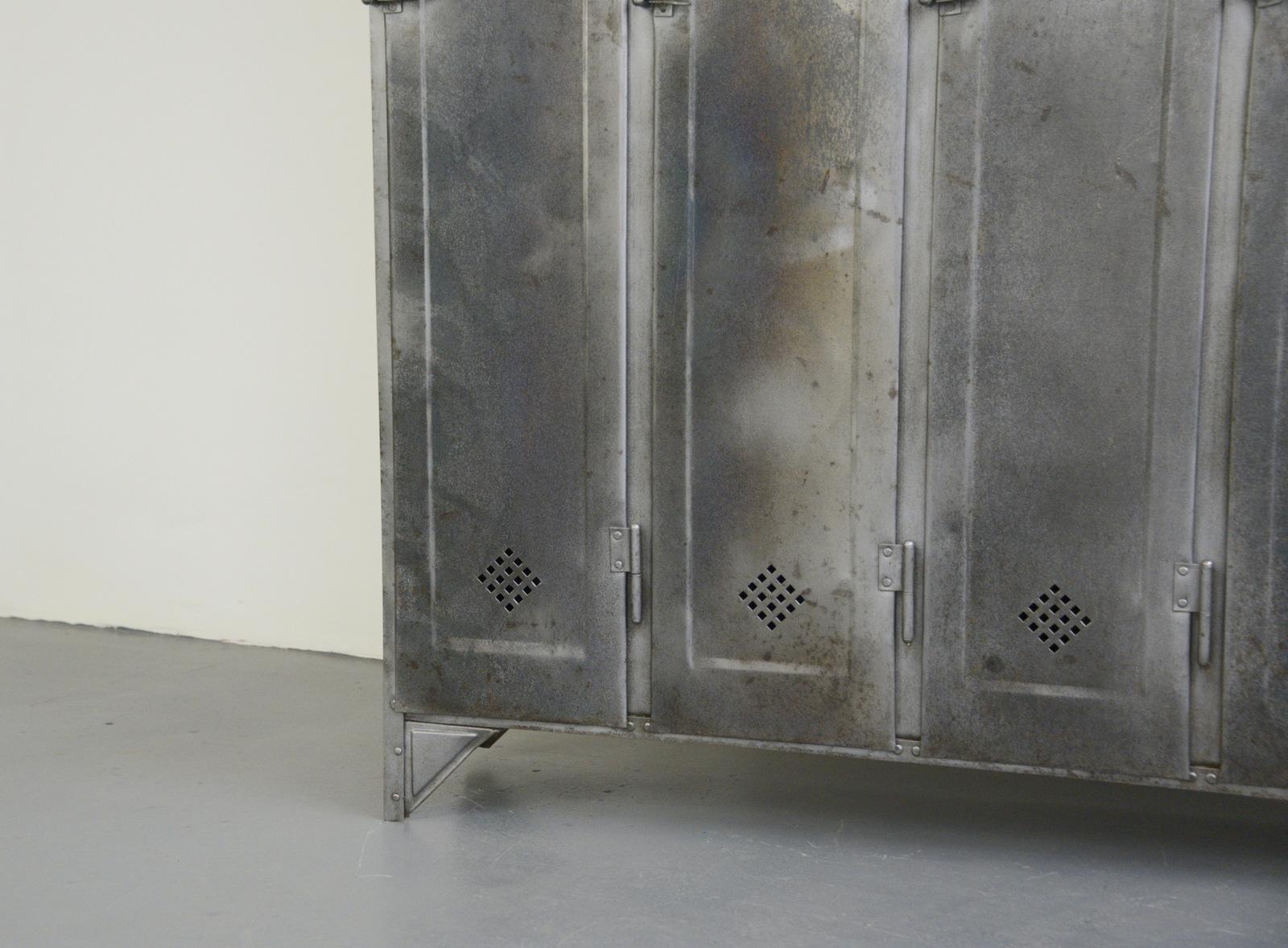 Industrial lockers by Otto Kind, circa 1920s

- Pressed steel doors
- Diamond shaped vents
- Original makers badge
- Each locker has 4 storage shelves
- Made by Otto Kind
- German, 1920s
- Measures: 180cm tall x 150cm wide x 33cm