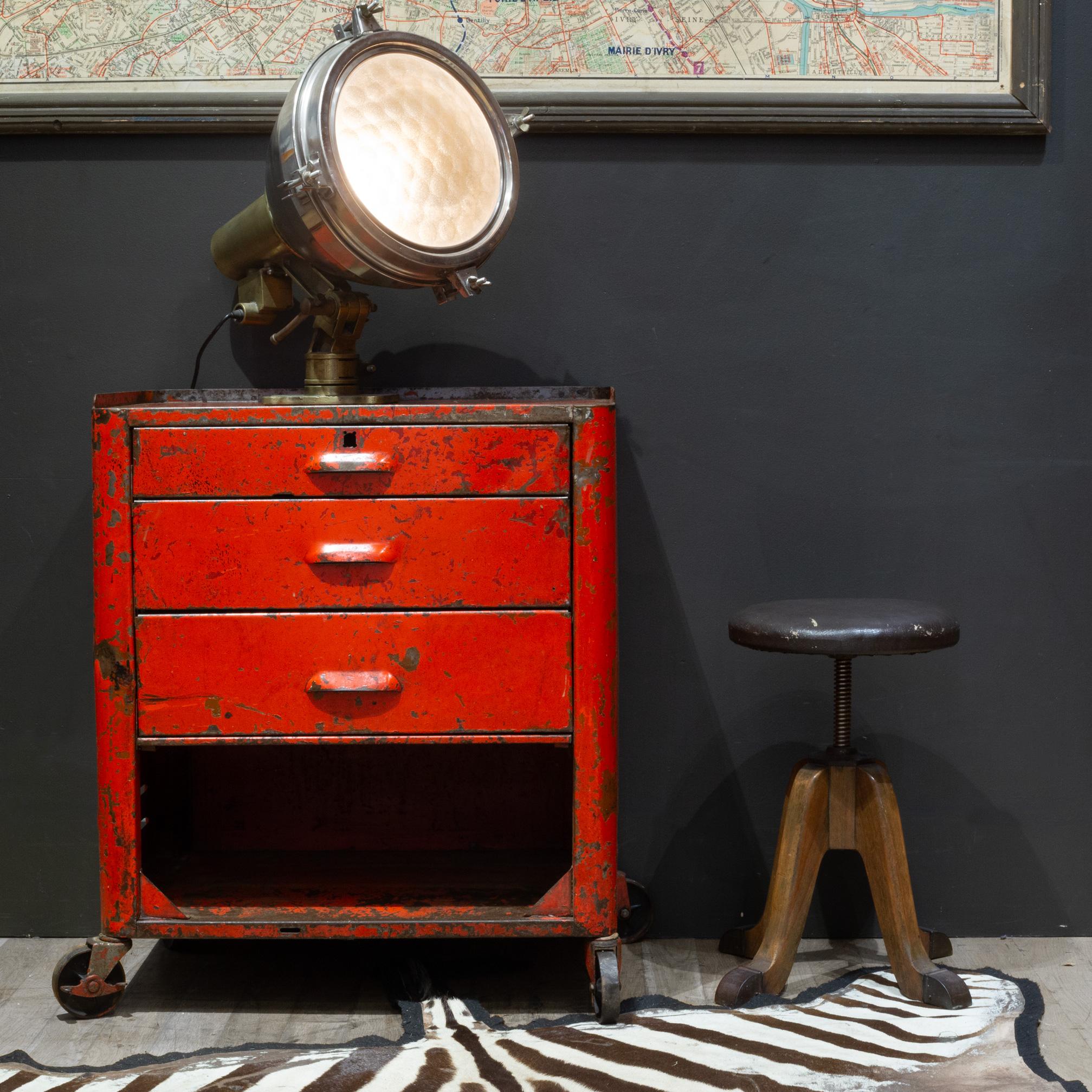 ABOUT

An original industrial machinist metal rolling cart with three drawers, lower cabinet and steel wheels. The wheels on the left side have locking brake mechanisms. Top two drawer bottoms are perforated. Lower cabinet has lift up cover that