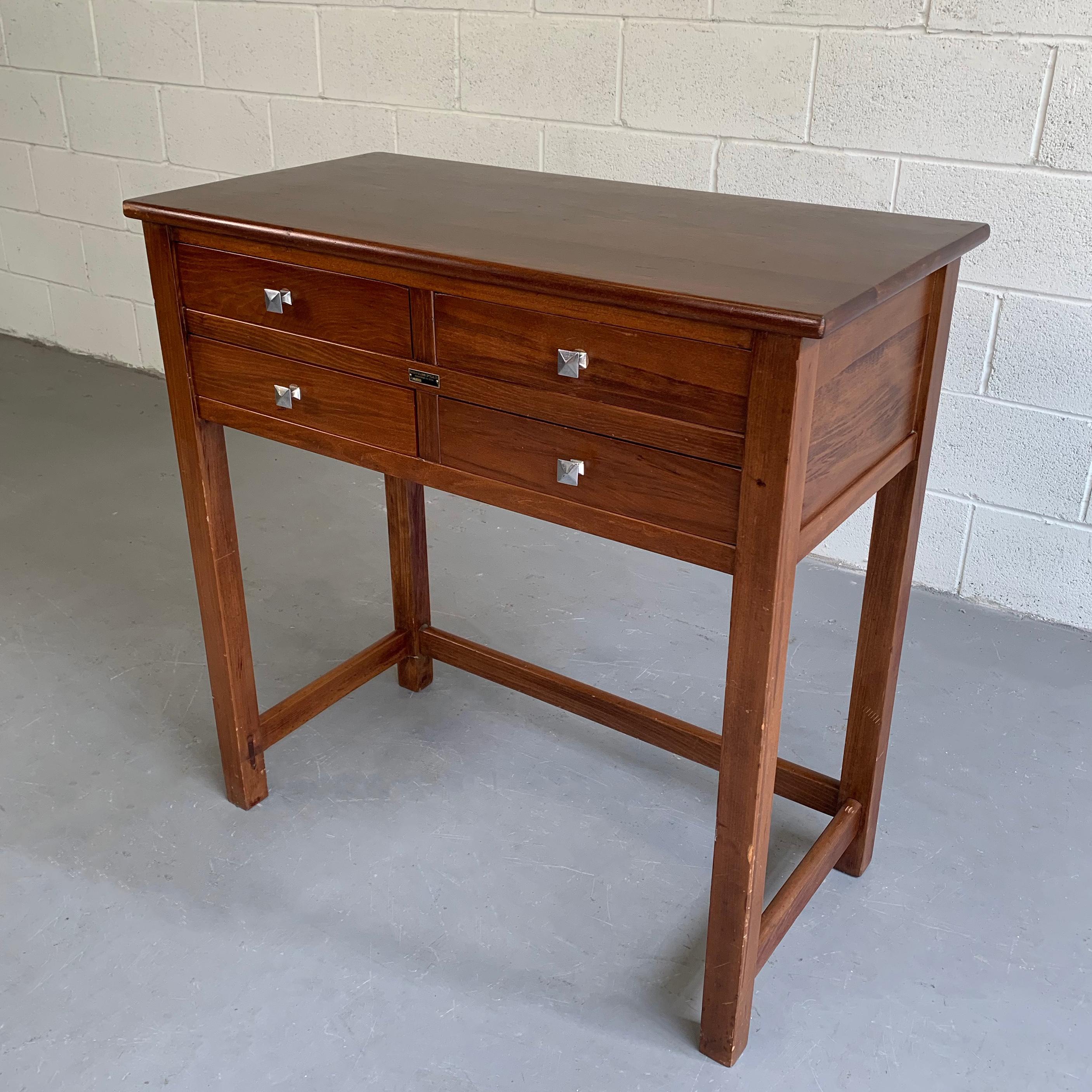 Early 20th century, mahogany, eye examination, console table by Bausch & Lomb features 4 drawers at 14 inches wide and 3 inches height with chrome pulls.