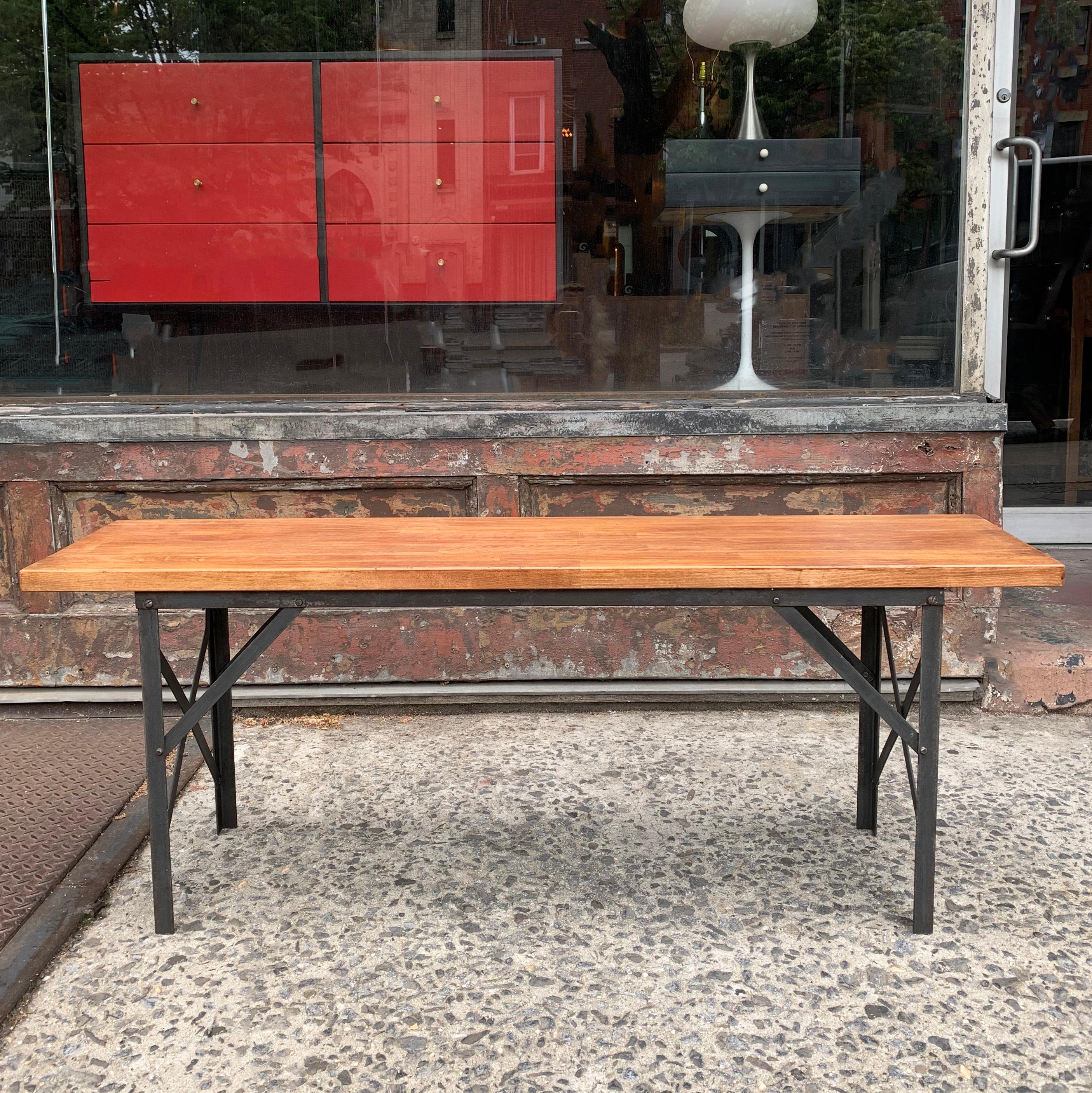 Industrial bench features a solid maple top with angle iron base.