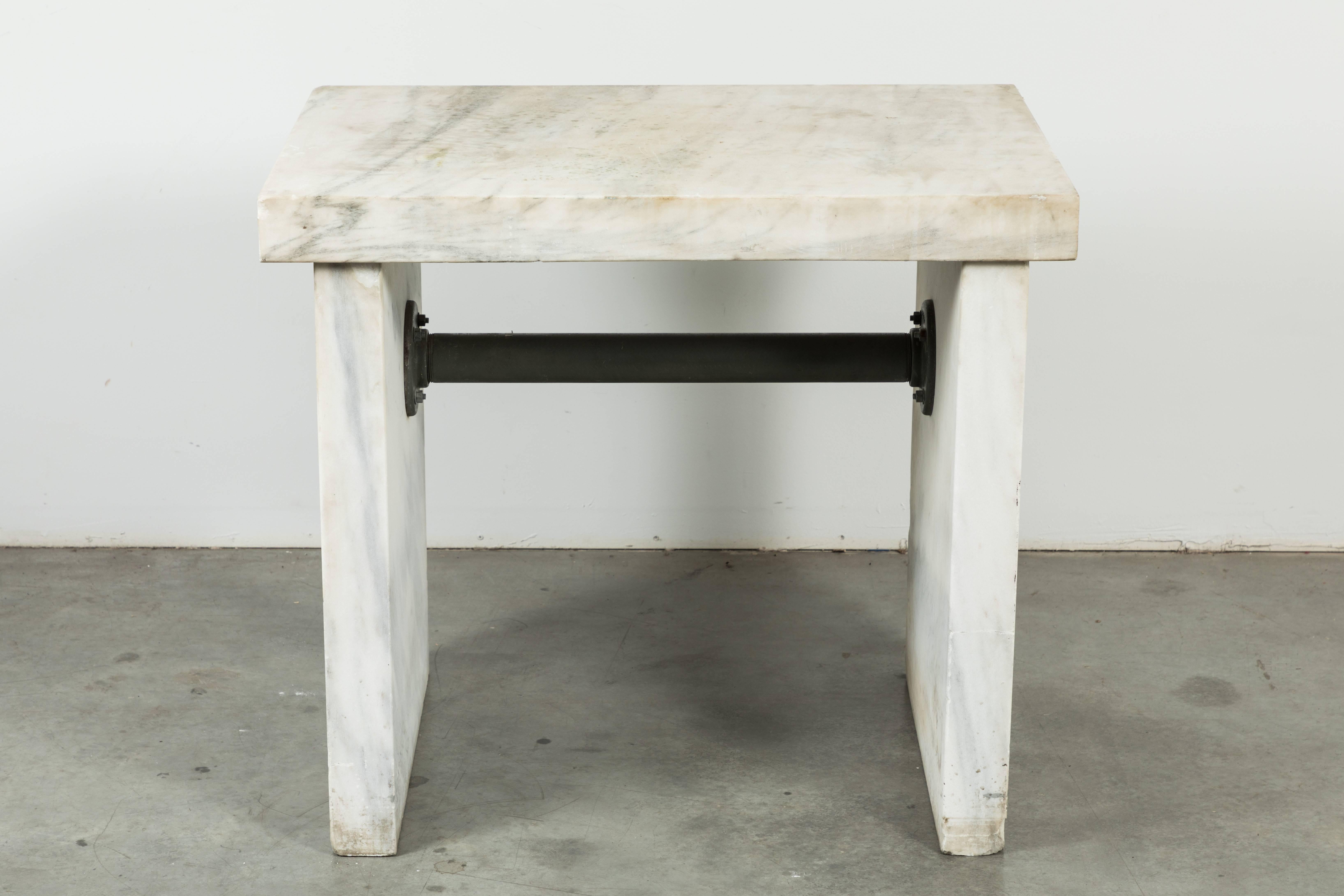 Chunky marble slab table found in the Midwest. Most likely an industrial factory table. Uses could have been for candy making, an industrial bakery or lab. Awesome honed marble with the perfect amount of patina and wear. Functional kitchen work