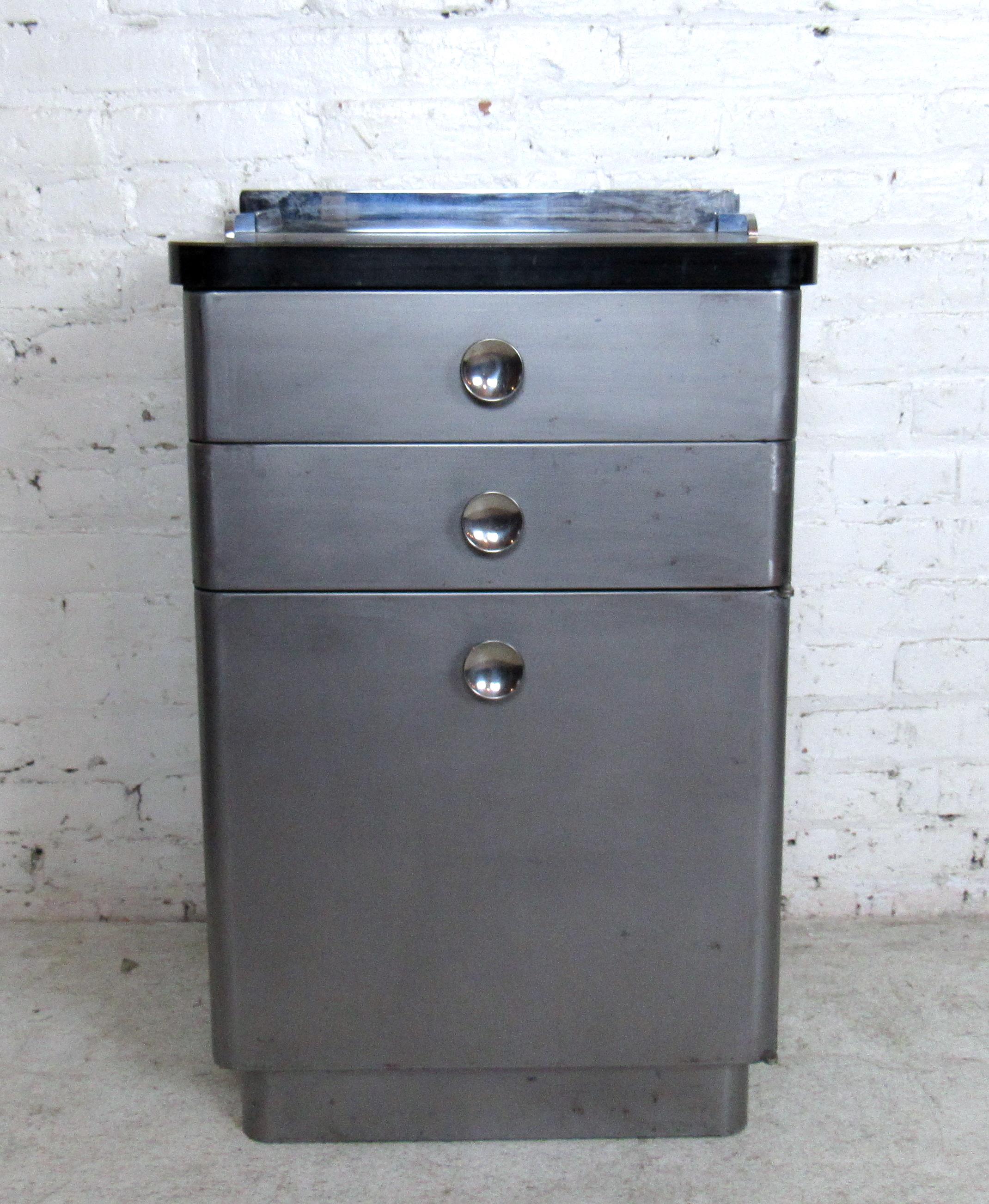 Single vintage industrial metal cabinet featuring two drawers, round pulls, and a spacious storage section underneath. Stamped A. S Aloe Company.

Please confirm item location (NY or NJ).

  