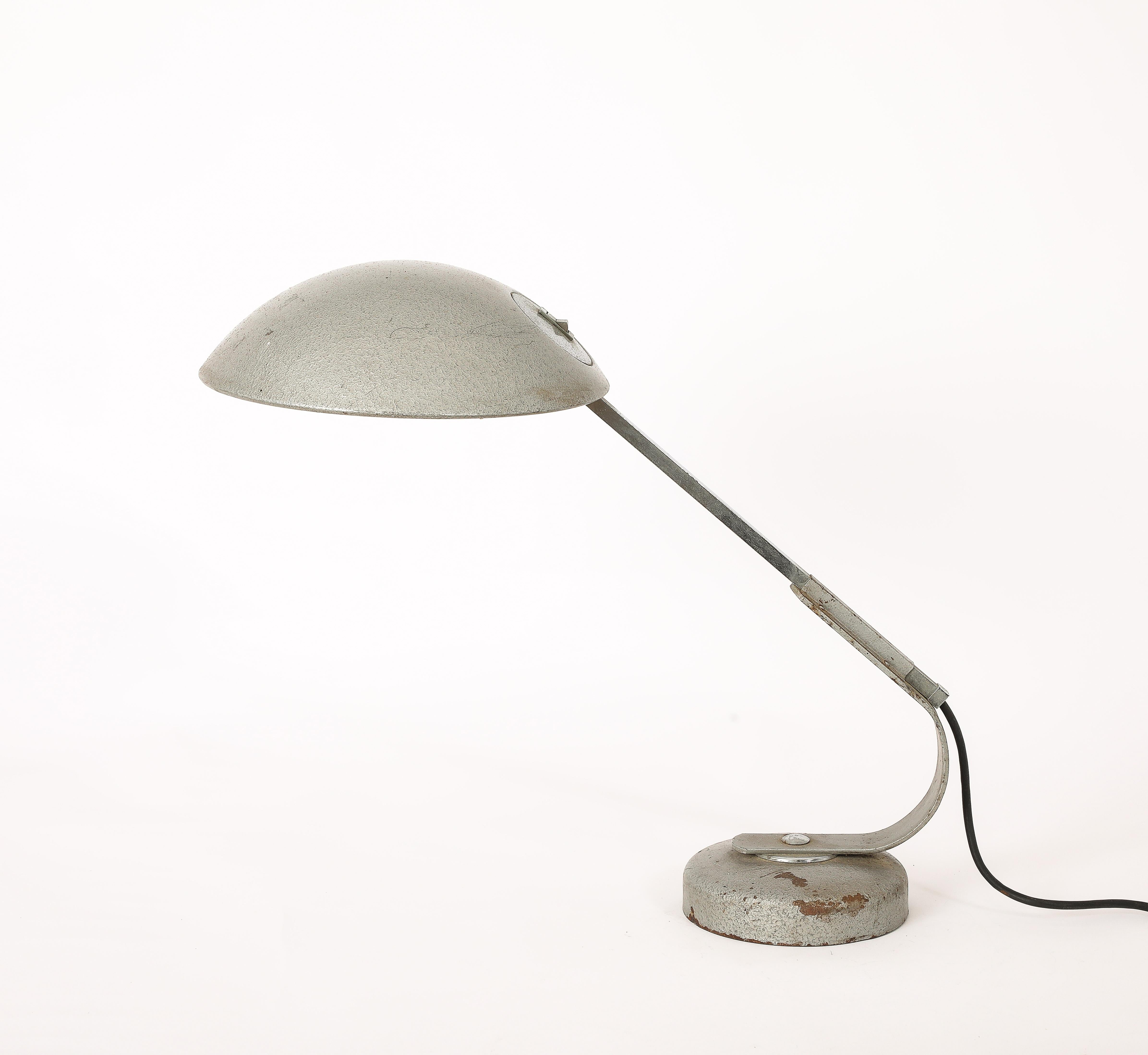 This desk lamp is in the manner of Karl Trabant and has an original chrome and silver enamel finish. France 1950s