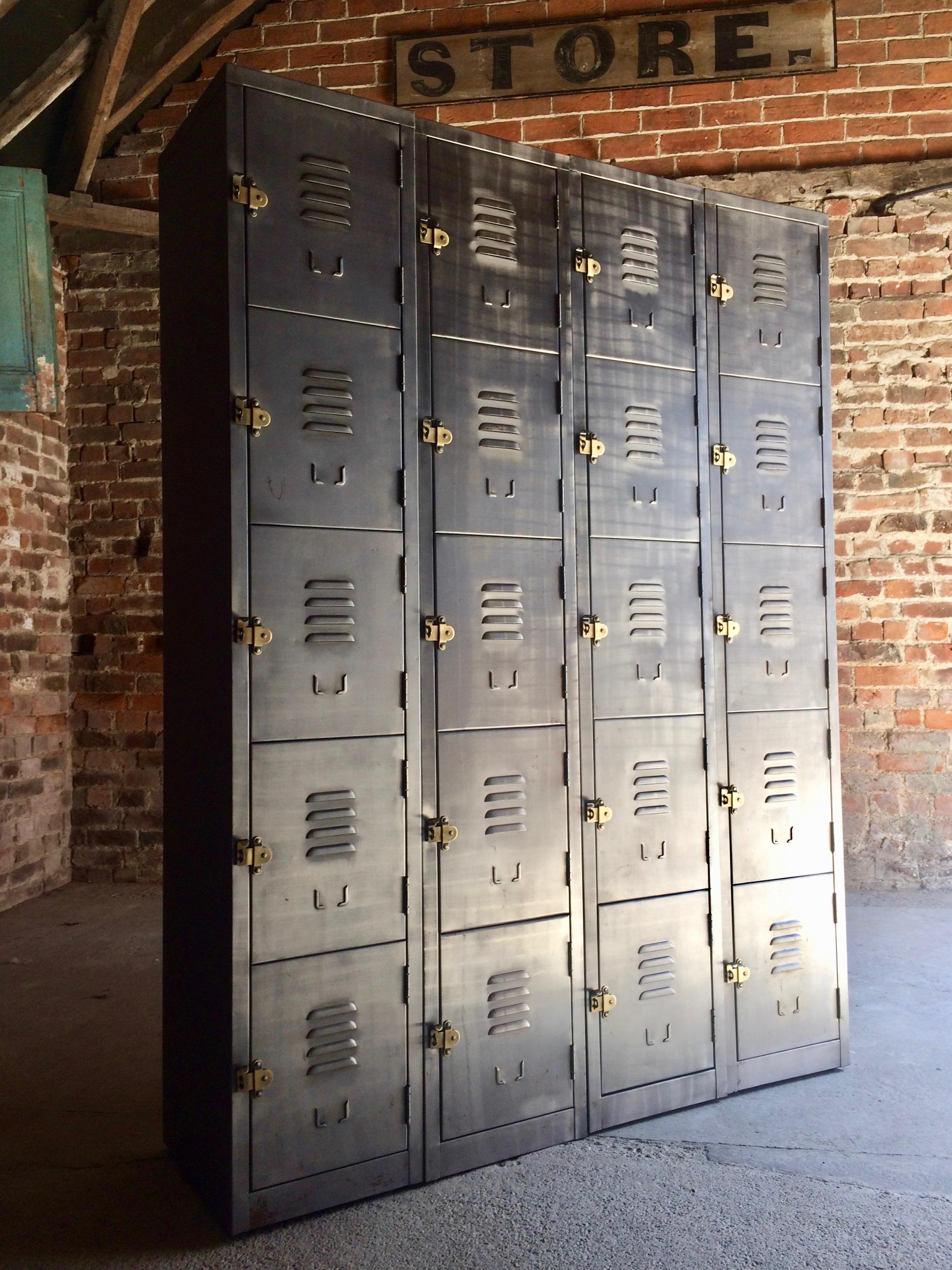 Fabulous set of four Industrial banks of buffed steel lockers of exceptional quality and style, each set of lockers with five individual compartments each with brass pull handles and index card holder, can be used individually, in a pair or as a