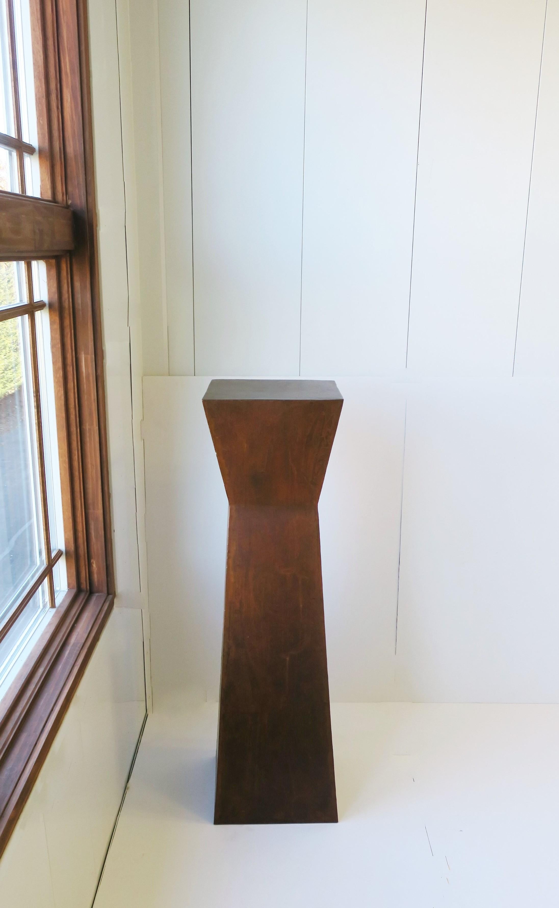 **This is one of two pillars shown; this pillar is the taller of the two, the lower pillar has sold. 

An industrial minimalist weathered metal pedestal pillar column stand, circa late-20th century. Intentionally weathered/distressed metal pedestal