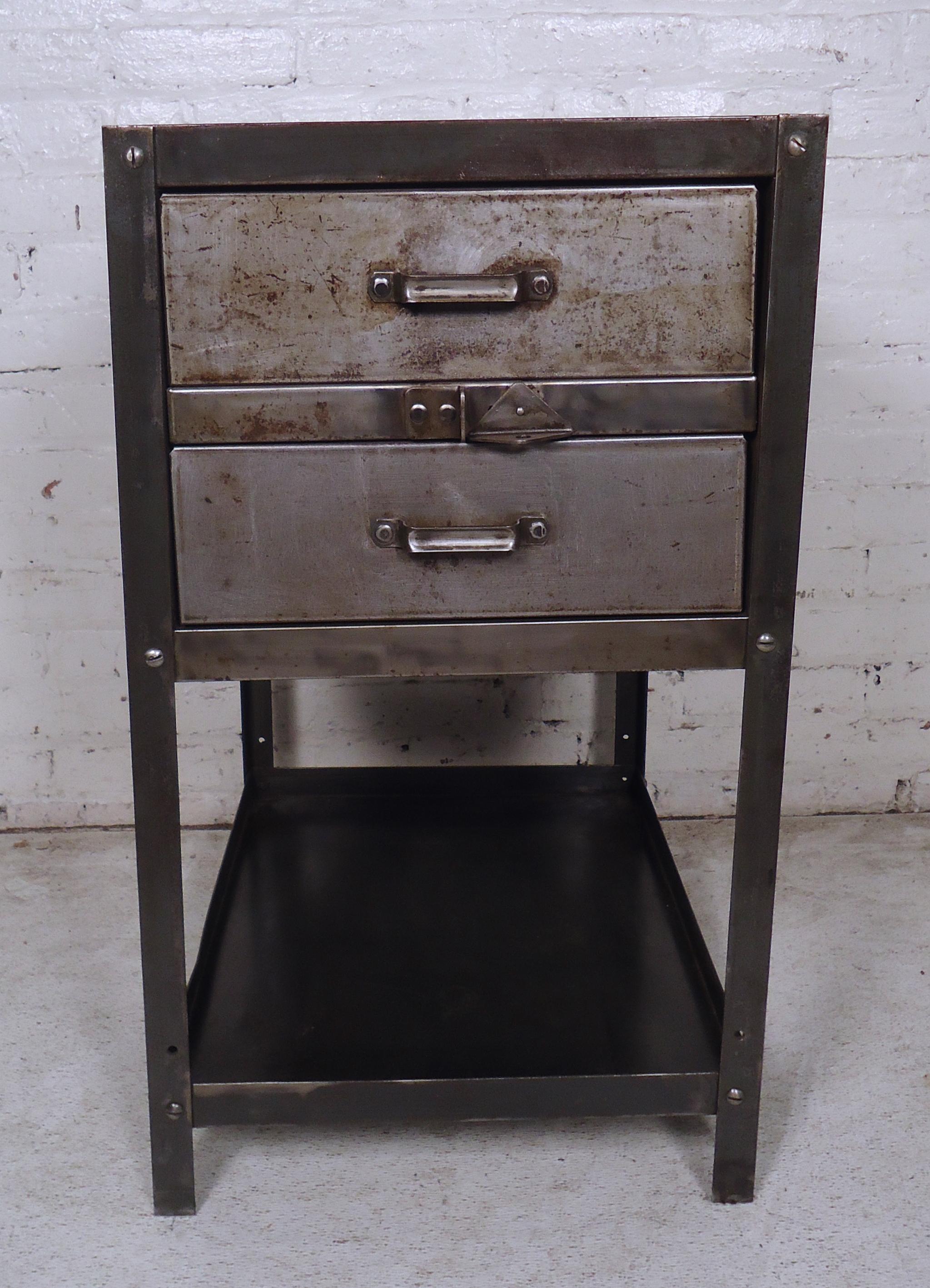This vintage modern industrial metal side cabinet features two drawers and two tiers for storage.

Please confirm item location NY or NJ with dealer.
