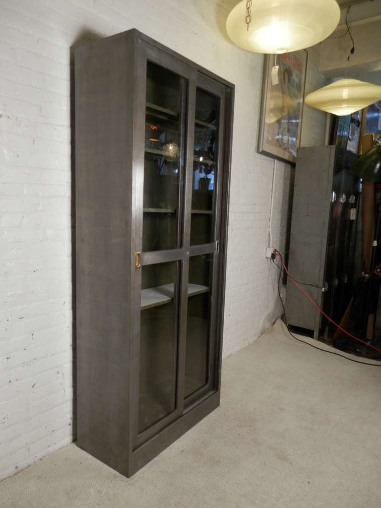 metal cabinet with sliding glass doors