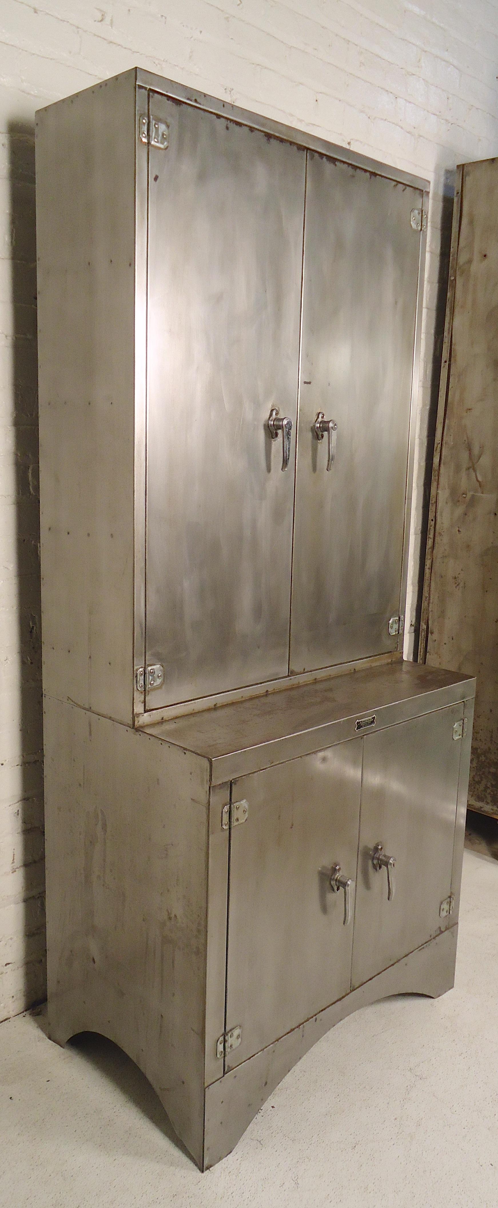 Tall cabinet restored in a bare metal style finish. Has two storage cabinets with file dividers that can be removed.

(Please confirm item location - NY or NJ - with dealer).
 