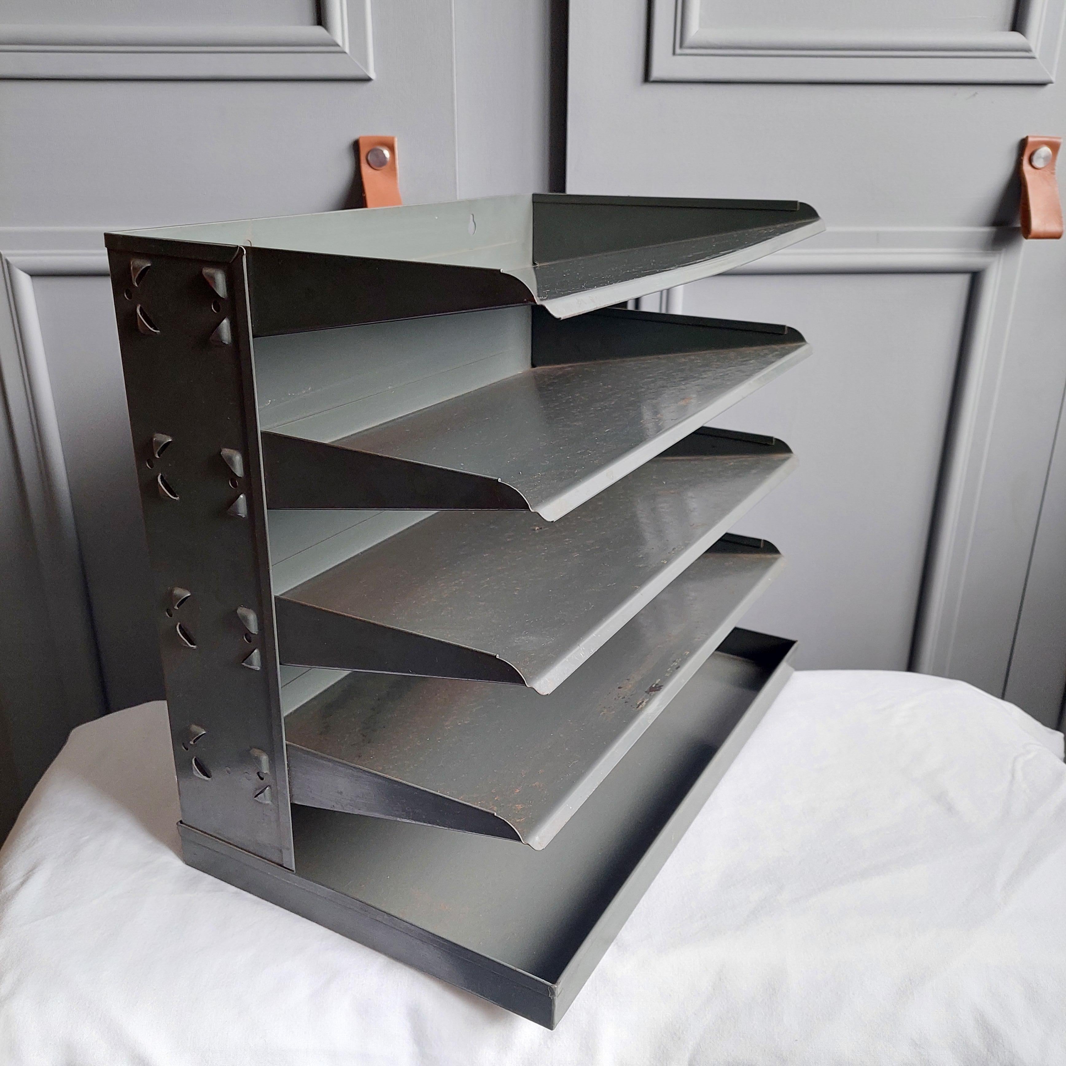 Vintage tiered metal filing tray, from the 1940’s - 1950’s. 
A Sophisticated Grey and Stylish Design Filing Tray. 

Can be either free standing on a desk, or wall mounted. 
Likely to have been used in a military setting.
filing open tray cabinet