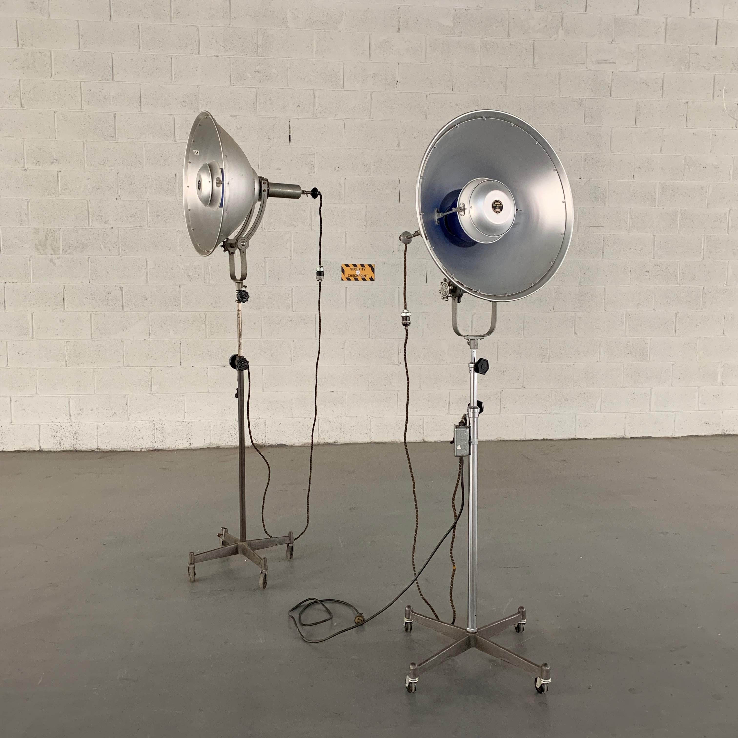 Impressive, Industrial, midcentury, rolling, aluminum, “Studio Modeling Lite” photography lamp features a height adjustable stem from 69 -96 inches tall and articulating, 24 inch diameter shades with diffuser. The lamp can accept up to a 300 watt