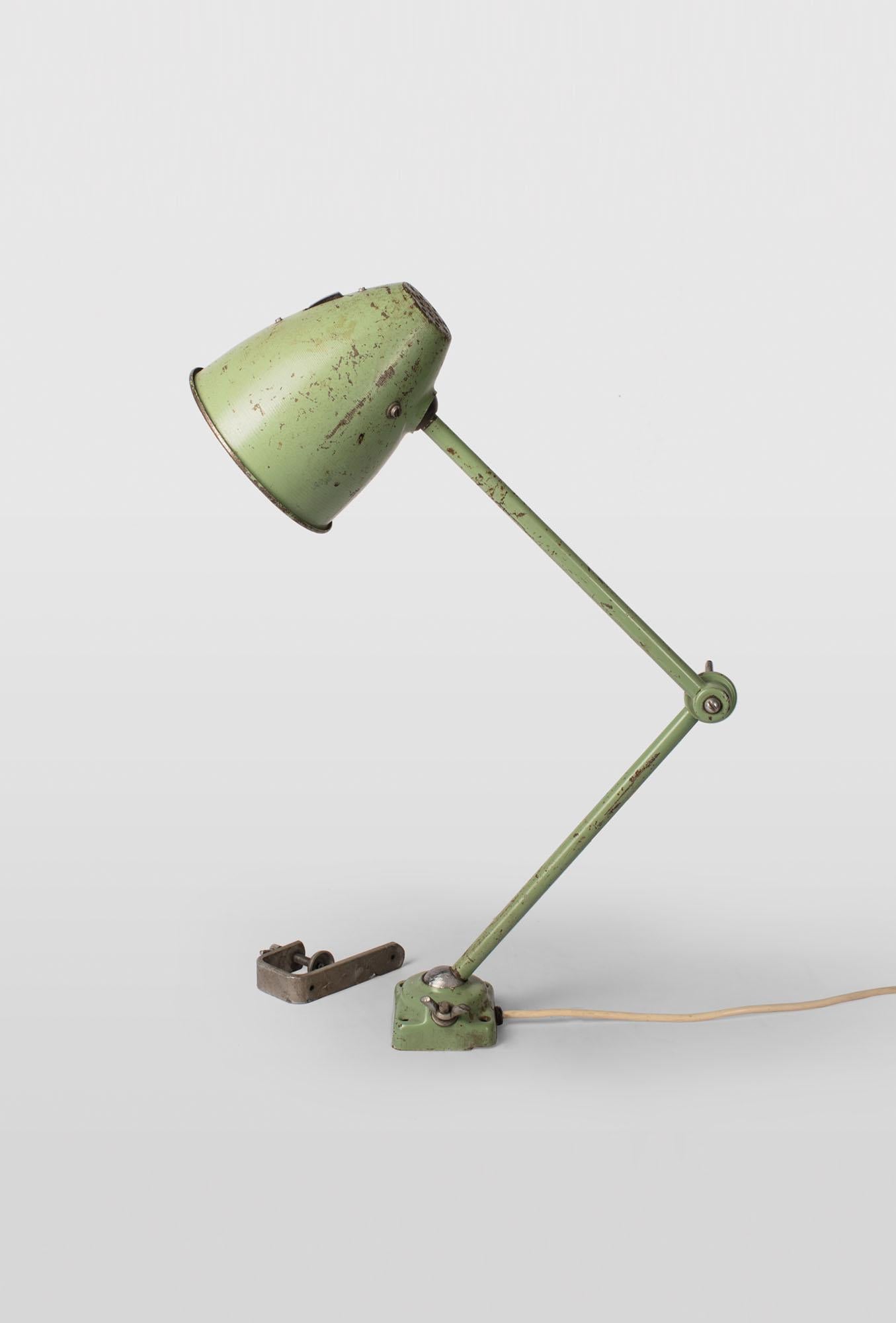 Industrial table lamp with adjustable shade, two adjustable joints. Great patina. 
Mounted directly to the table or to the side of the table. Shade is 15 cm diameter.
