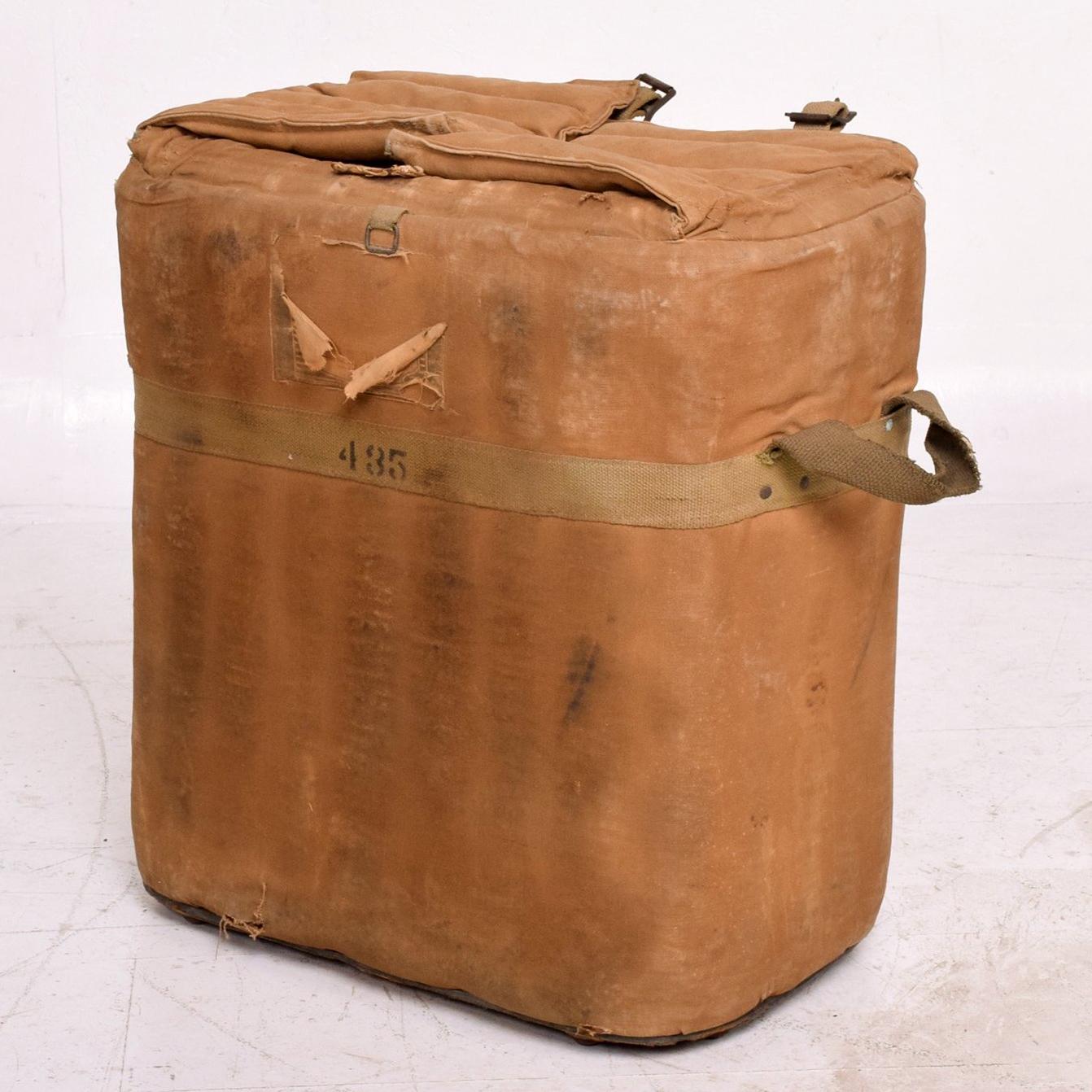 US vintage military surplus ice cooler chest designed in metal, canvas, cotton and leather presents in original distressed condition. circa 1940s.
Fabulous industrial prop has tons of character.
Functions as an ice chest tote or ideal as a catch