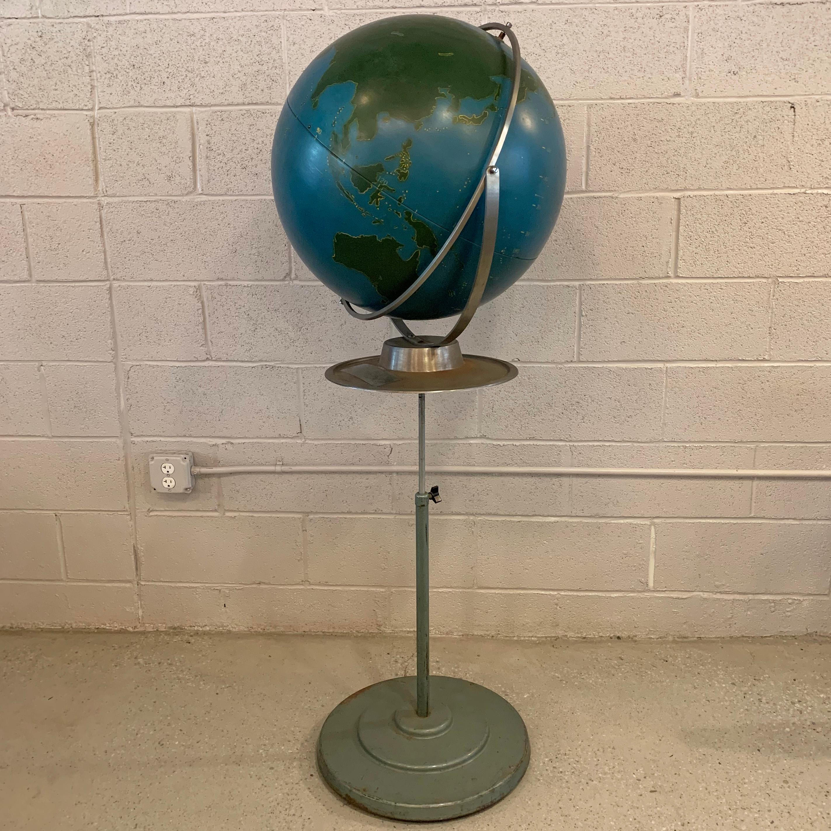 Large, strategic, military, painted steel, globe chalk globe by A.J. Nystrom on an adjustable 48 - 60 inches height, rolling, steel stand with ledge for chalk and eraser. The globe can be removed from the stand to be used as a table top globe as