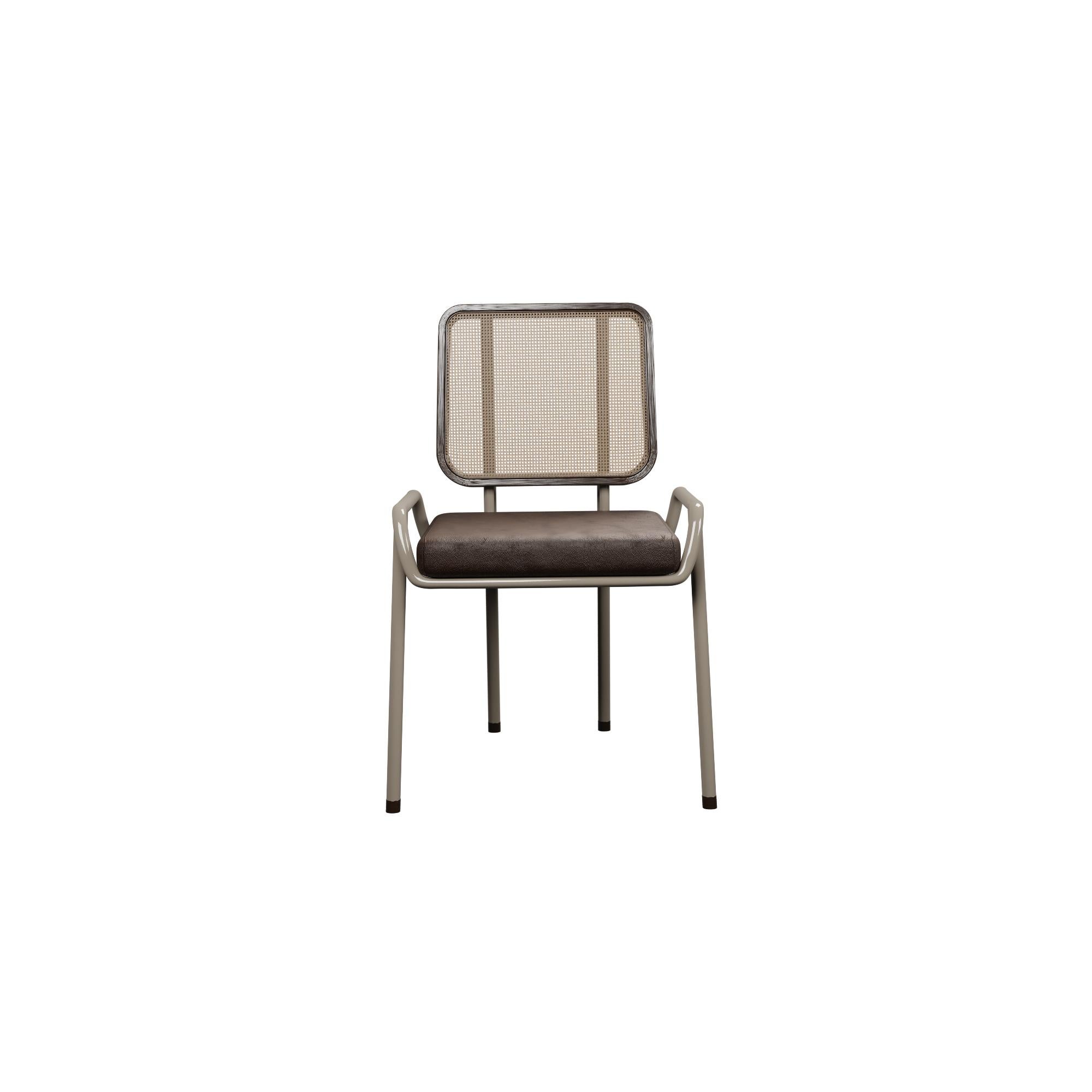 Murmurio's half arm DUV sturdy iron structure provides a solid foundation, while the intricately woven rattan backrest, supported by an ashwood frame, adds a touch of natural beauty. The seat is upholstered in genuine leather, offering both comfort
