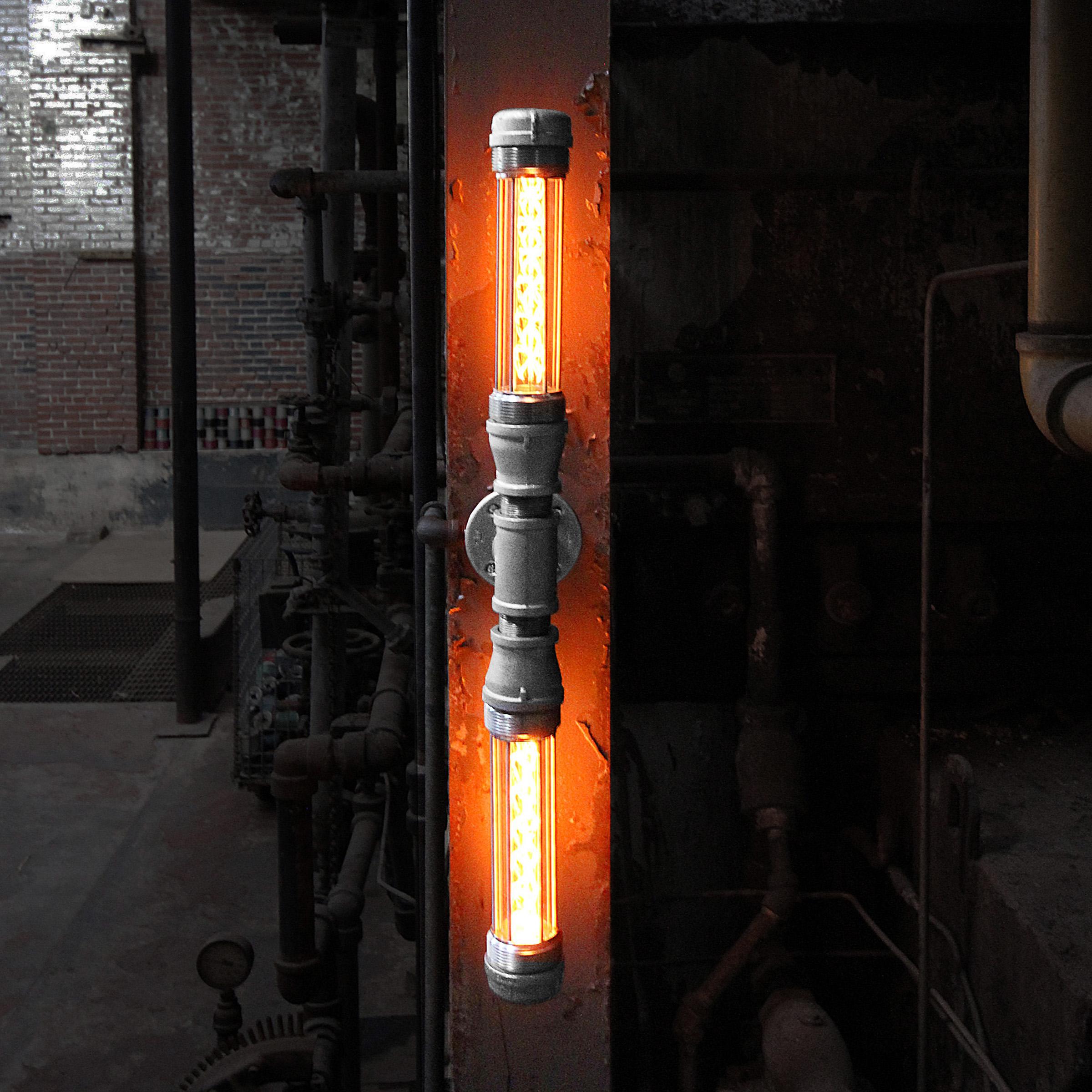 The Double Glow Worm industrial modern double wall sconce boasts two of our patented industrial light modules to create a warm and moody glow to illuminate your industrial decor, light a hallway, of use on either side of your front door.  Use this