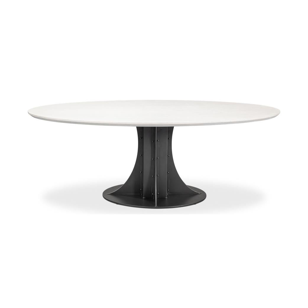 Un mélange parfait de style contemporain et de flair industriel. La table est dotée d'un élégant plateau ovale fabriqué en bois, avec une finition peinte en blanc qui offre un look épuré et moderne.

La base, en fer avec une finition élégante en