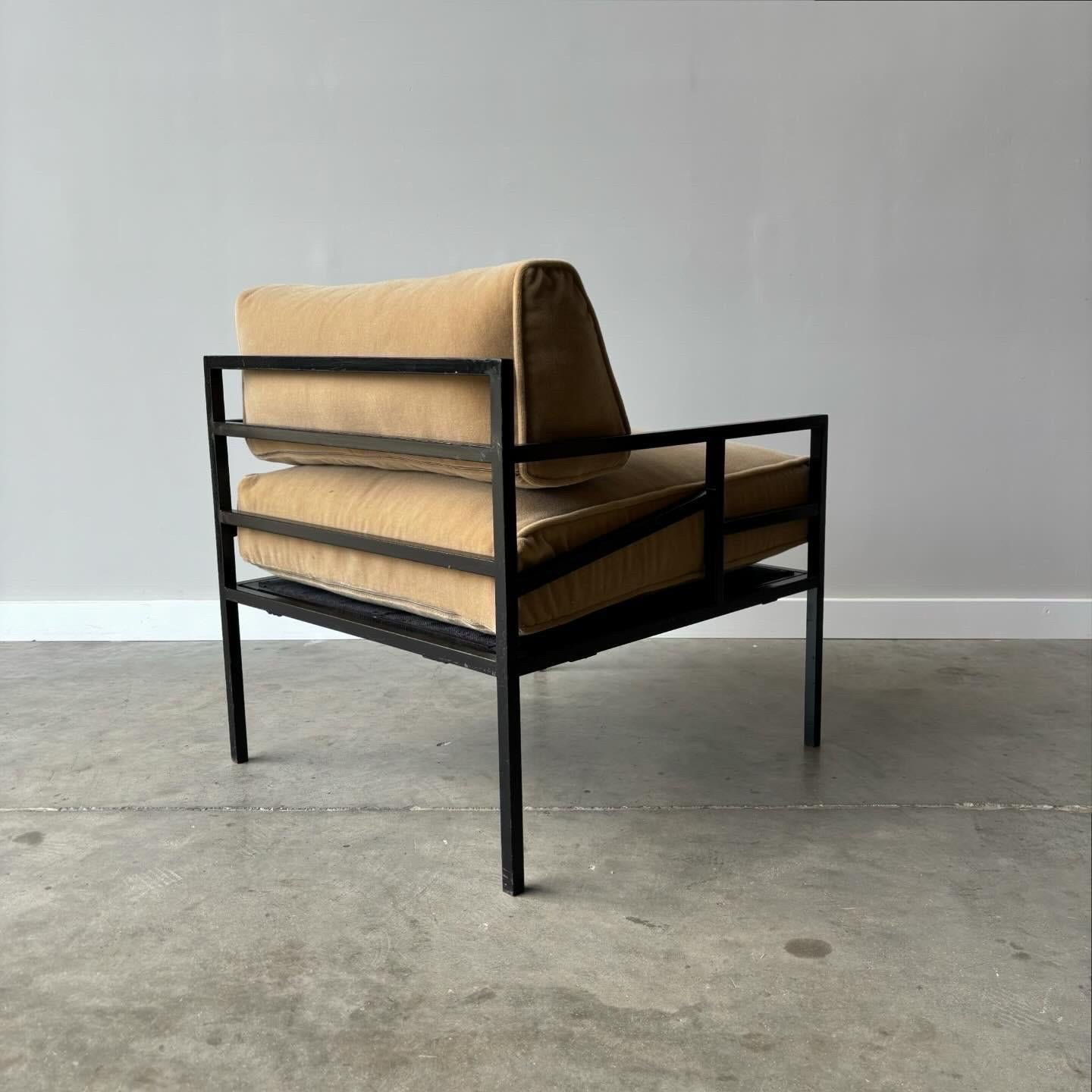 A pair of German lounge chairs dating to the 1960s. Recently imported and newly upholstered in mohair. The steel geometric frames offer great contrast to the soft down filled cushions.

26” wide, 30” deep, 30” high, 18” seat height
