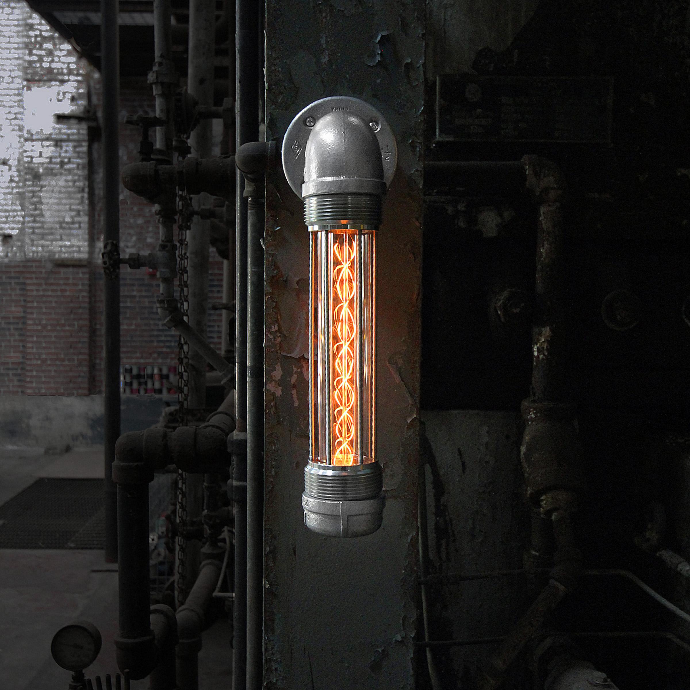 The Glow Worm modern industrial wall sconce boasts one of our patented industrial light modules which can be oriented to extend in either direction to create a warm and moody glow to illuminate your industrial decor or light the way in a hallway. 