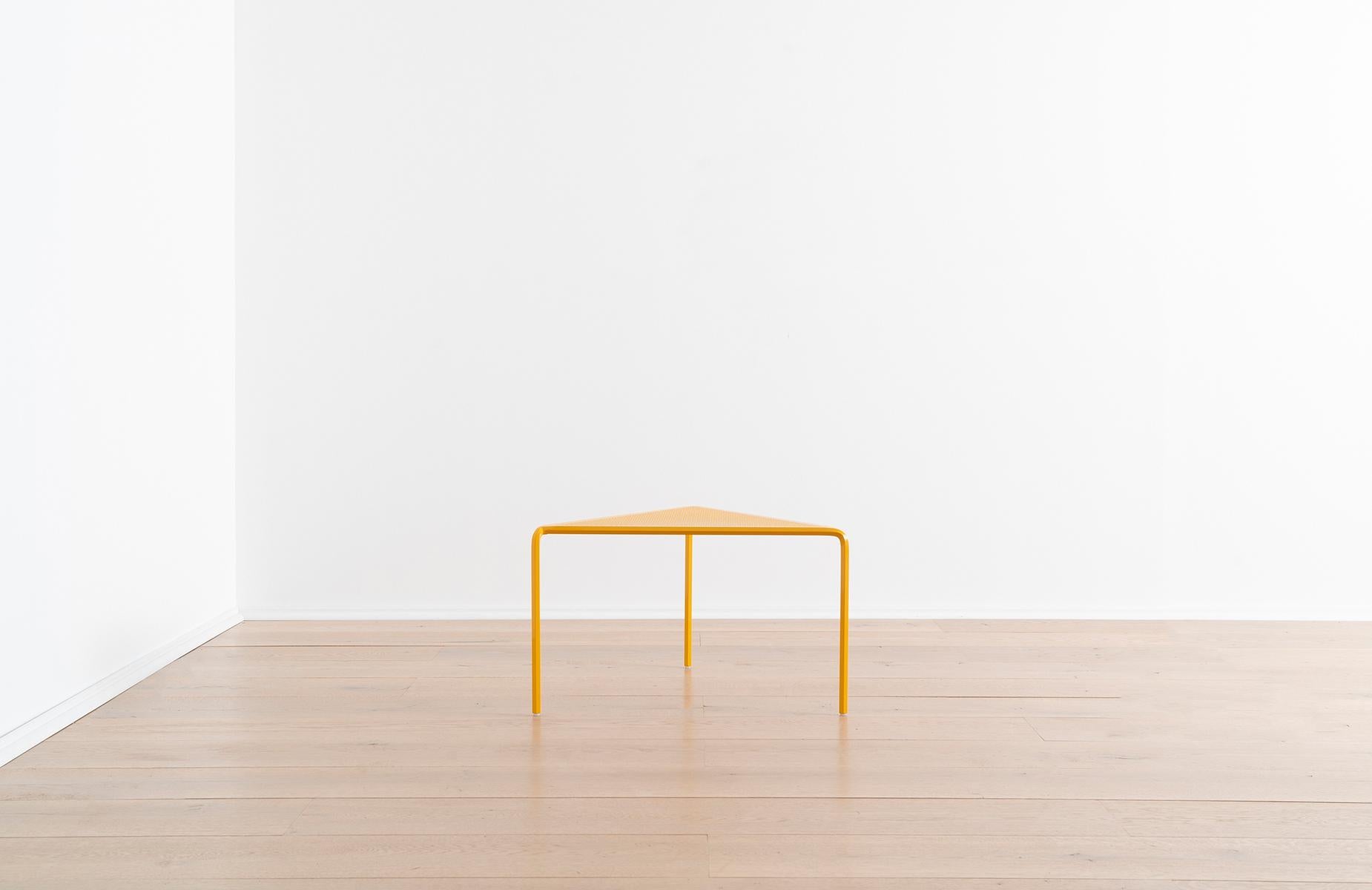 This industrial yellow steel coffee table could be the slim end table your living room sofa or lounge chair is missing, the sturdy bedside table you and your water glass have been dreaming of, or the boost of support your favorite plant needs to