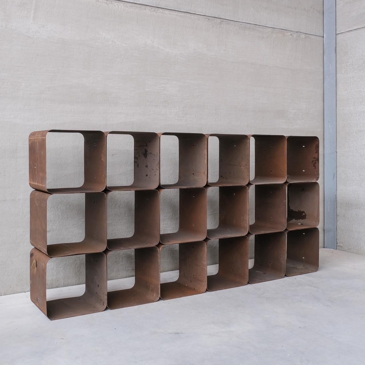A set of 18 metal cubes, which are modular, so can be combined to create shelving or used individually as side tables.

Belgium, circa 1970s.

In rustic original patina, with scuffs commensurate with age. These could be sprayed to update them, which