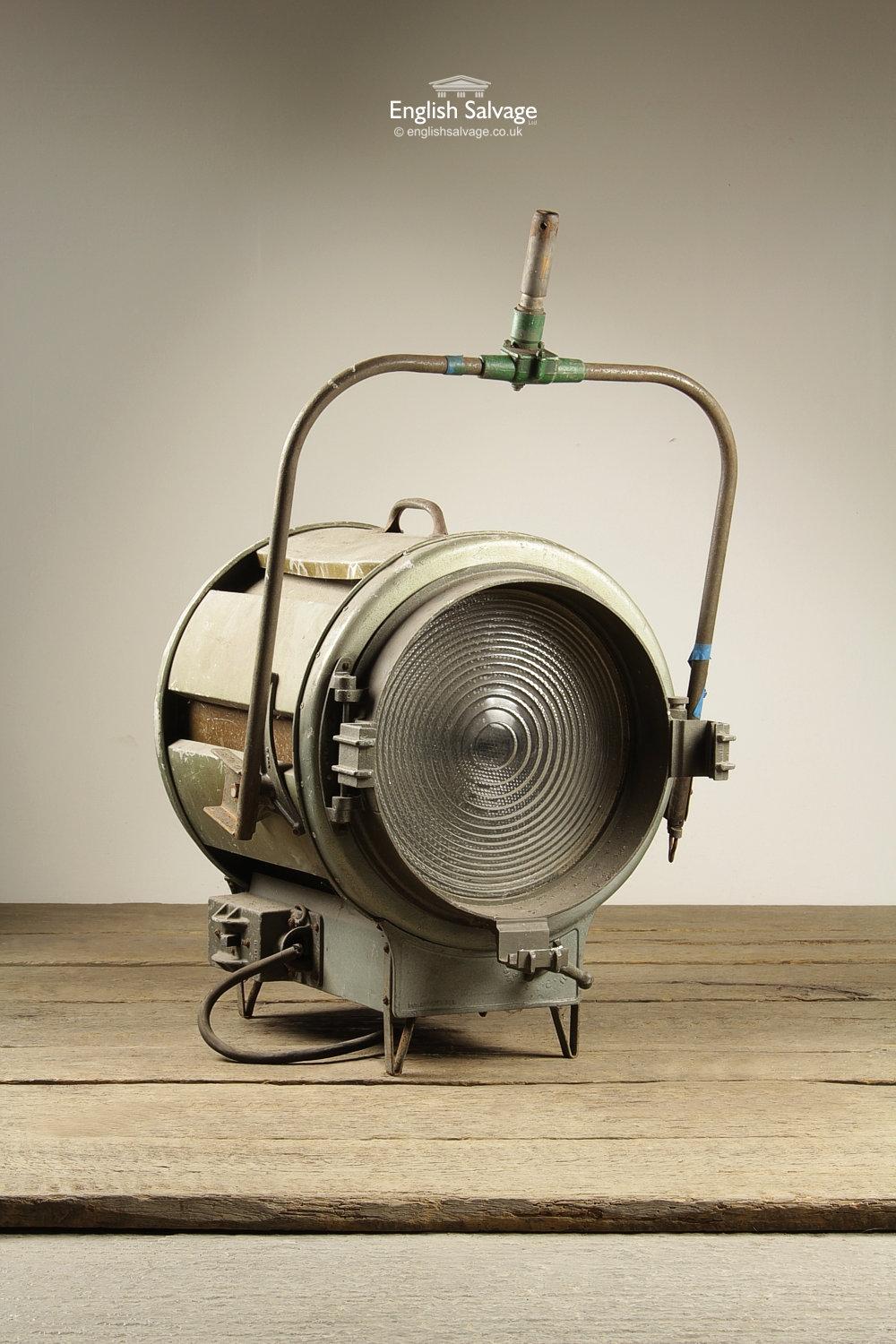 Large industrial Mole Richardson 1930's Hollywood spotlights with barn doors. Features a hinged door and fresnel lens and a 'spot' and 'flood' adjuster knob. Handle can be used to hang from the ceiling or mount on to a stand - stand shown is not