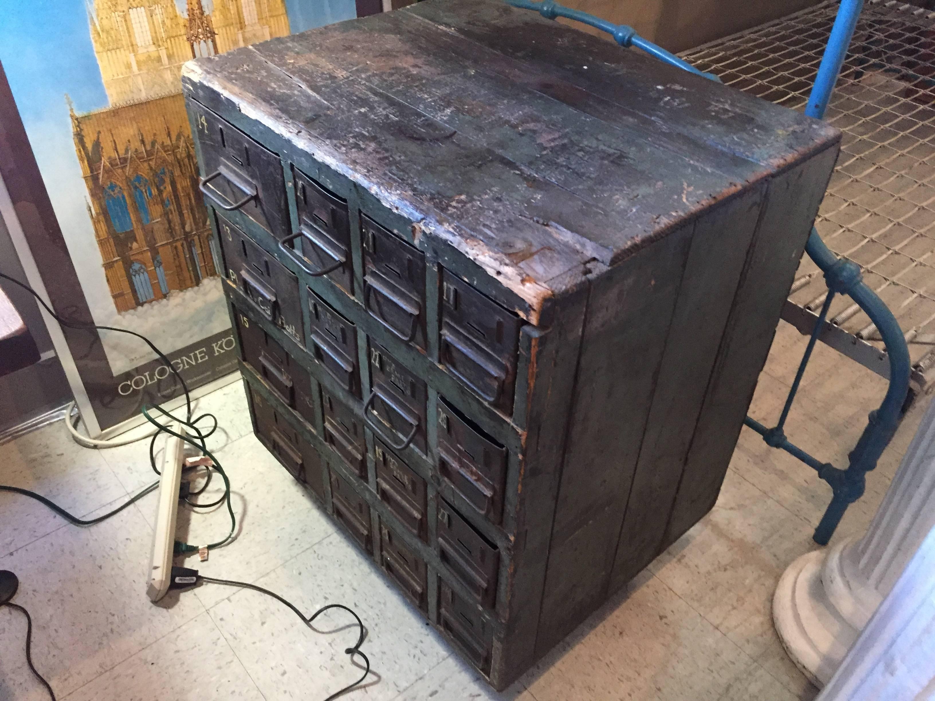 Industrial multi drawer cabinet for old automobile parts, circa 1930s-1940s. Original green paint. Great hand-painted labels on the metal drawers.