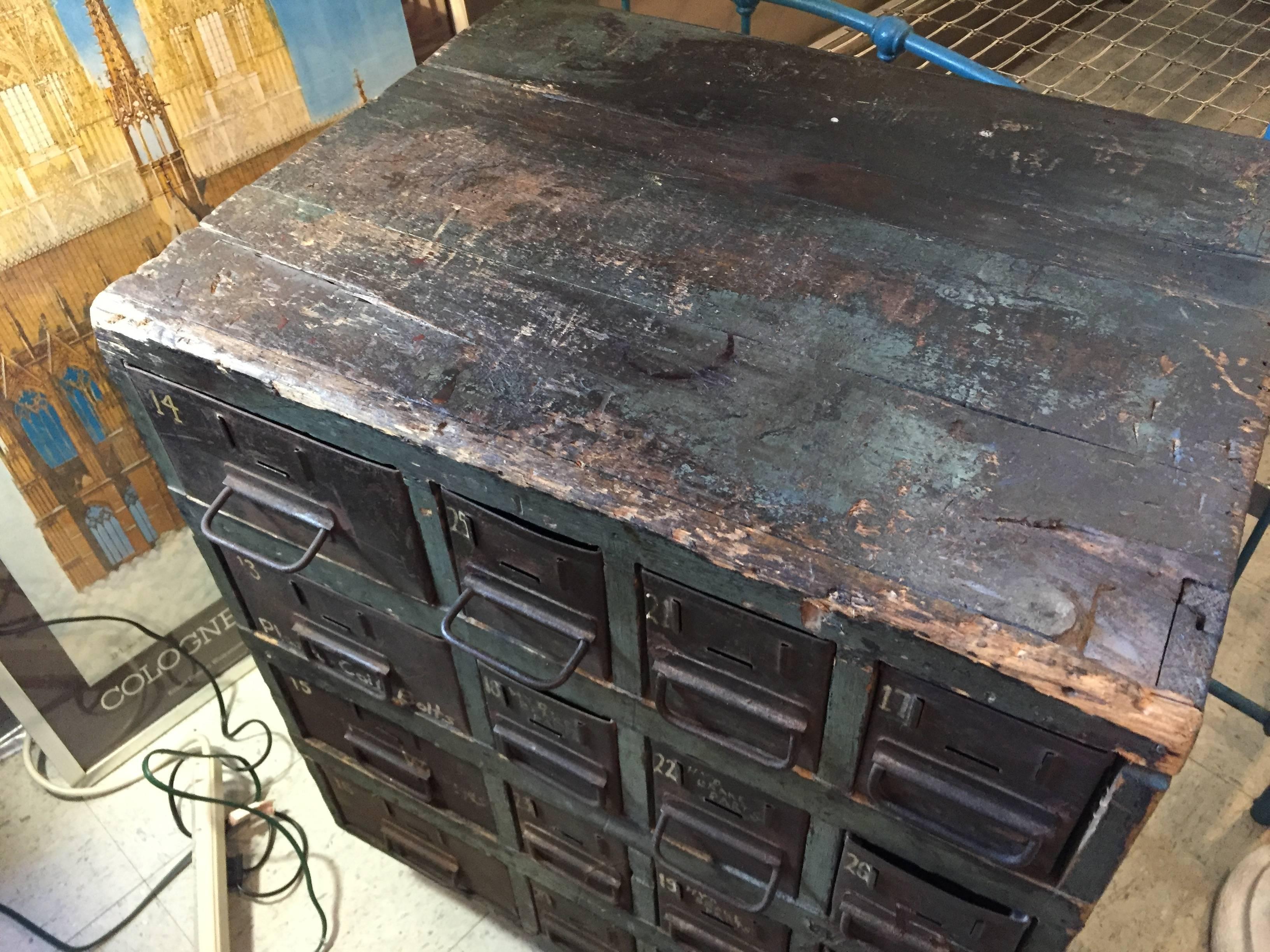 Great Industrial multi-drawer cabinet. Original green paint. Wooden cabinet with metal drawers labeled with hand-painted labels. Beautiful patina!