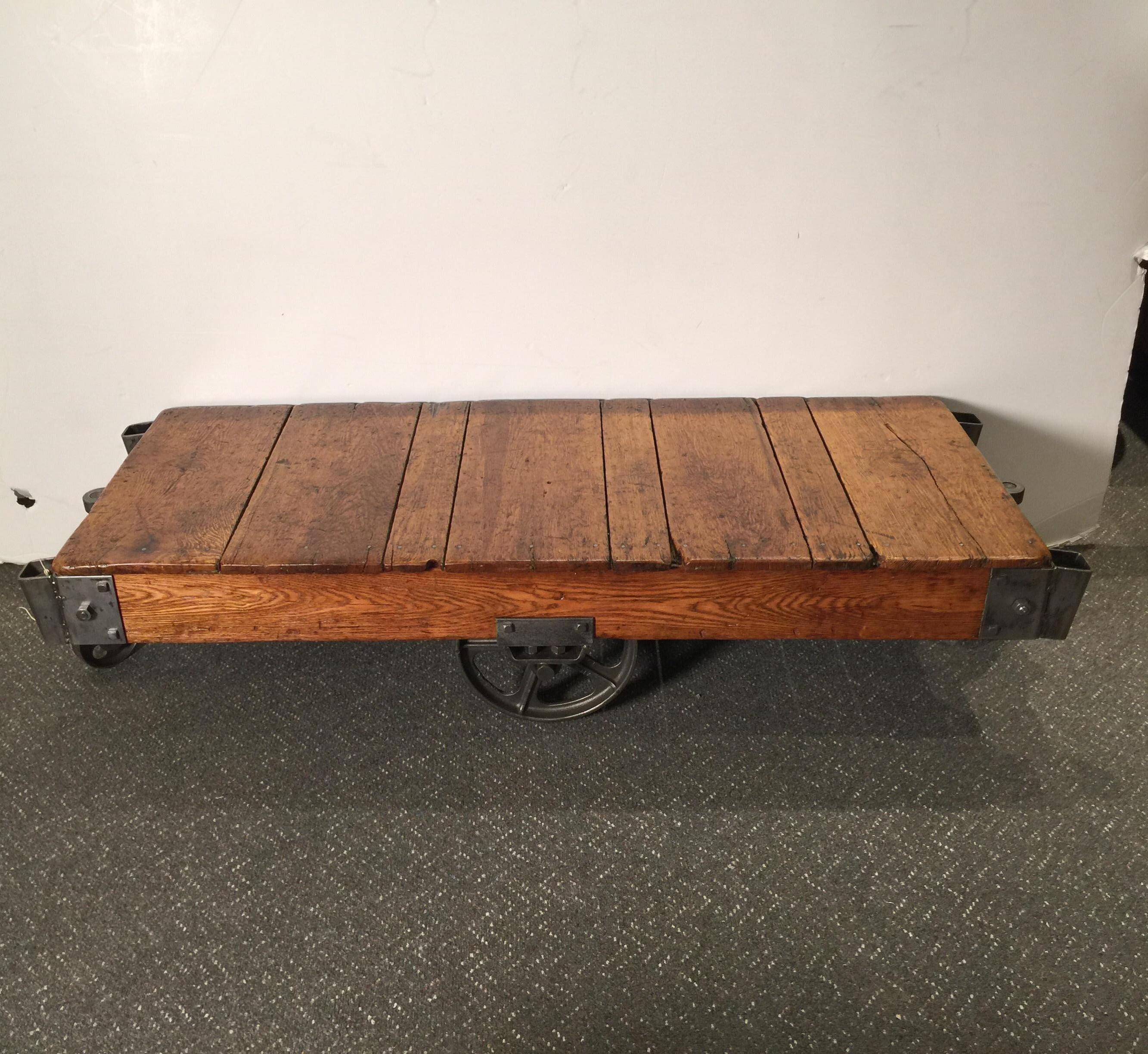 A steel and oak 1930s factory cart that has been fully restored. The steel has been cleaned and polished while still leaving age and patination. The oak had been detailed and much of the original character of the wood preserved with a warm aged