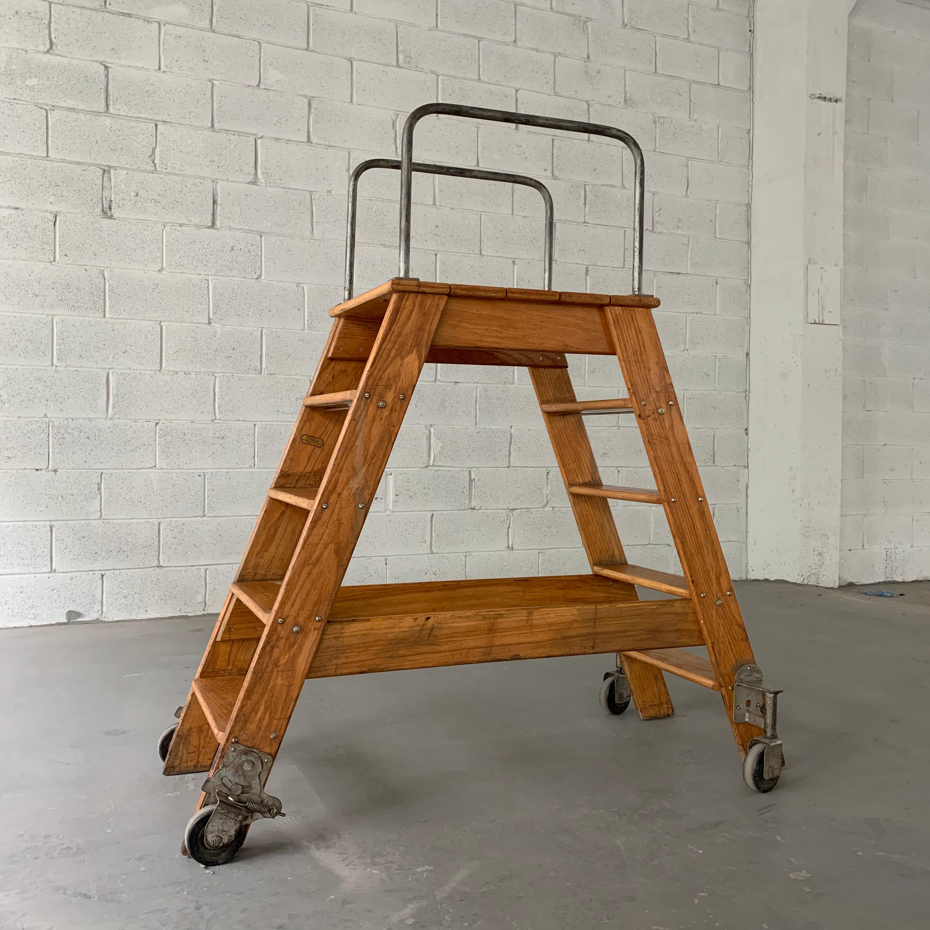 Industrial, rolling ladder by Putnam features an oak A frame with steel hardware. The top of the A frame is 42.5 inches height.