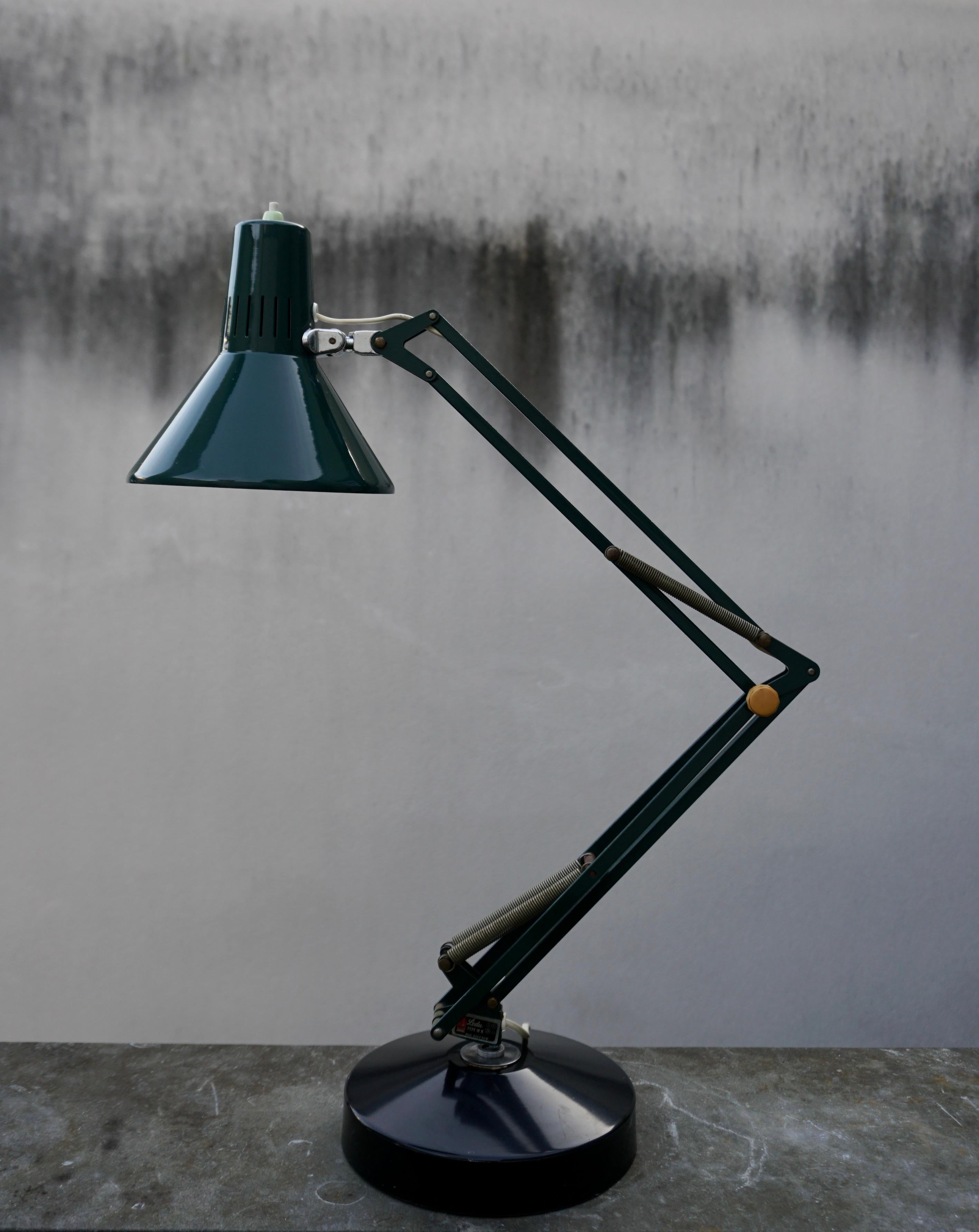 Industrial office desk lamp by Ledu, 1970s, Made in Sweden

Big adjustable articulated desk lamp by Ledu, made in Sweden in the 1970se. Nice patina. 
Maximum height is 80 cm.
Diameter 20 cm.