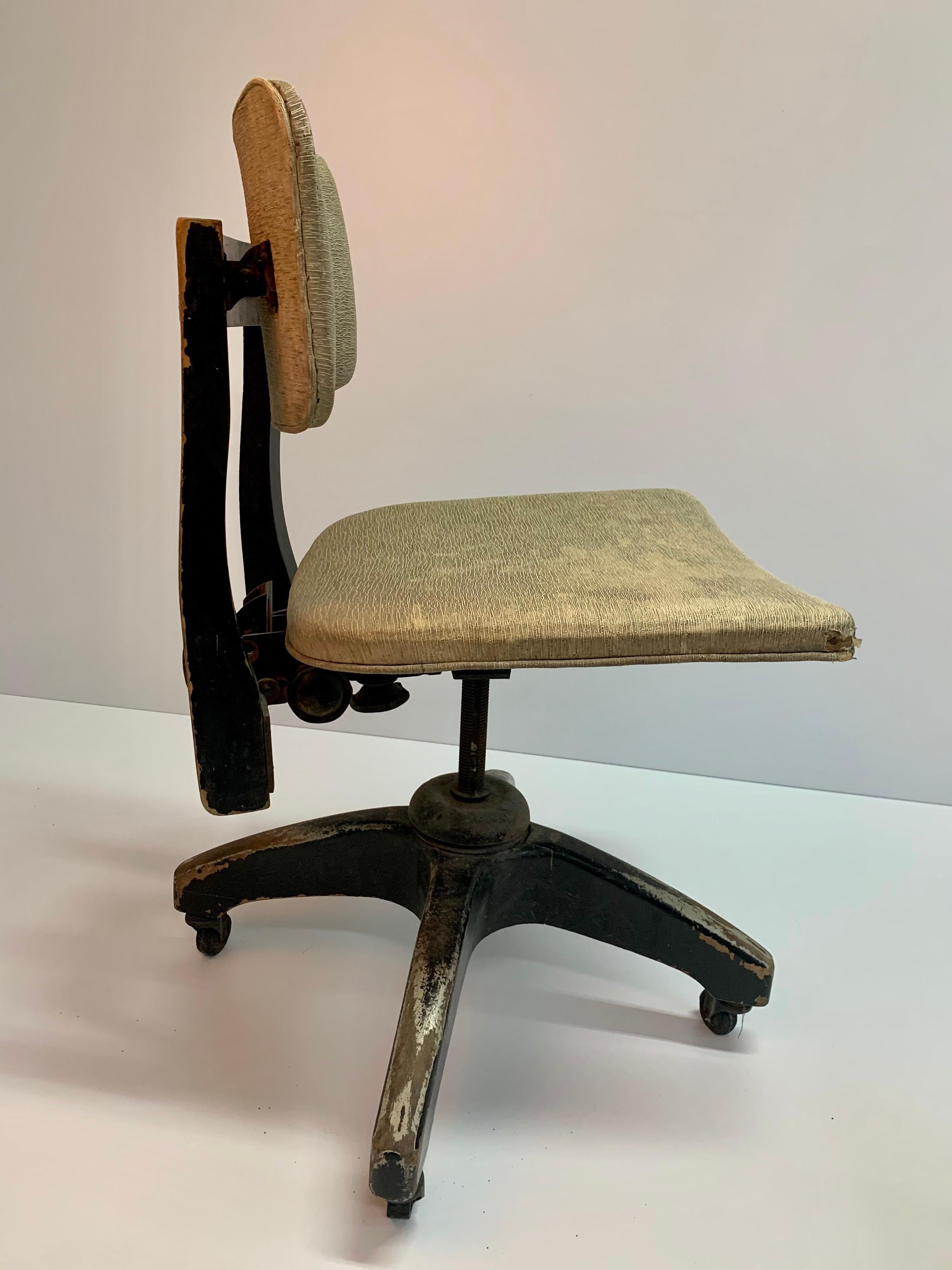 Rare swivel-tilt desk chair with original vinyl seat and seat back, solid wood base, and hard plastic wheels, signed with metallic stamp made IRGSA, circa 1950s less
Great collector's piece.