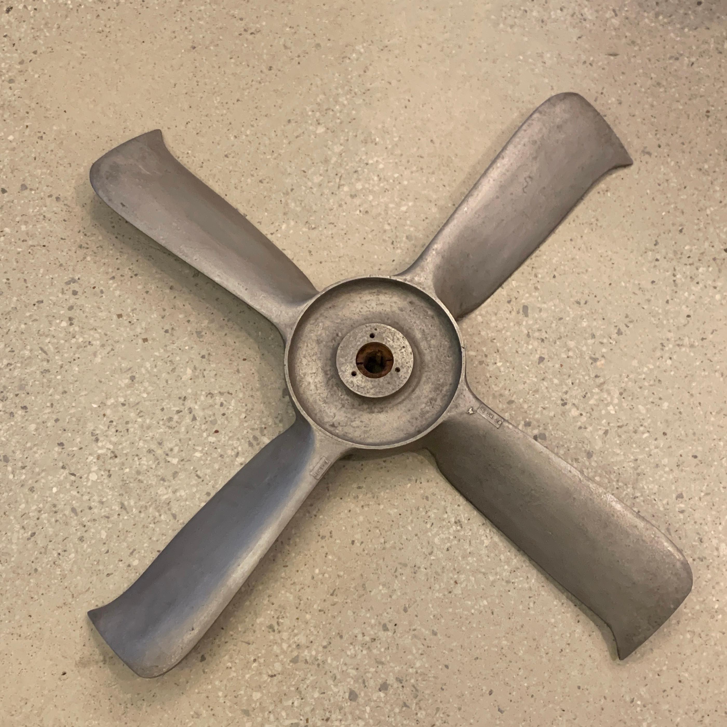 Large, aluminum, vent propeller is a wonderful, repurposed, industrial sculpture or architectural element.