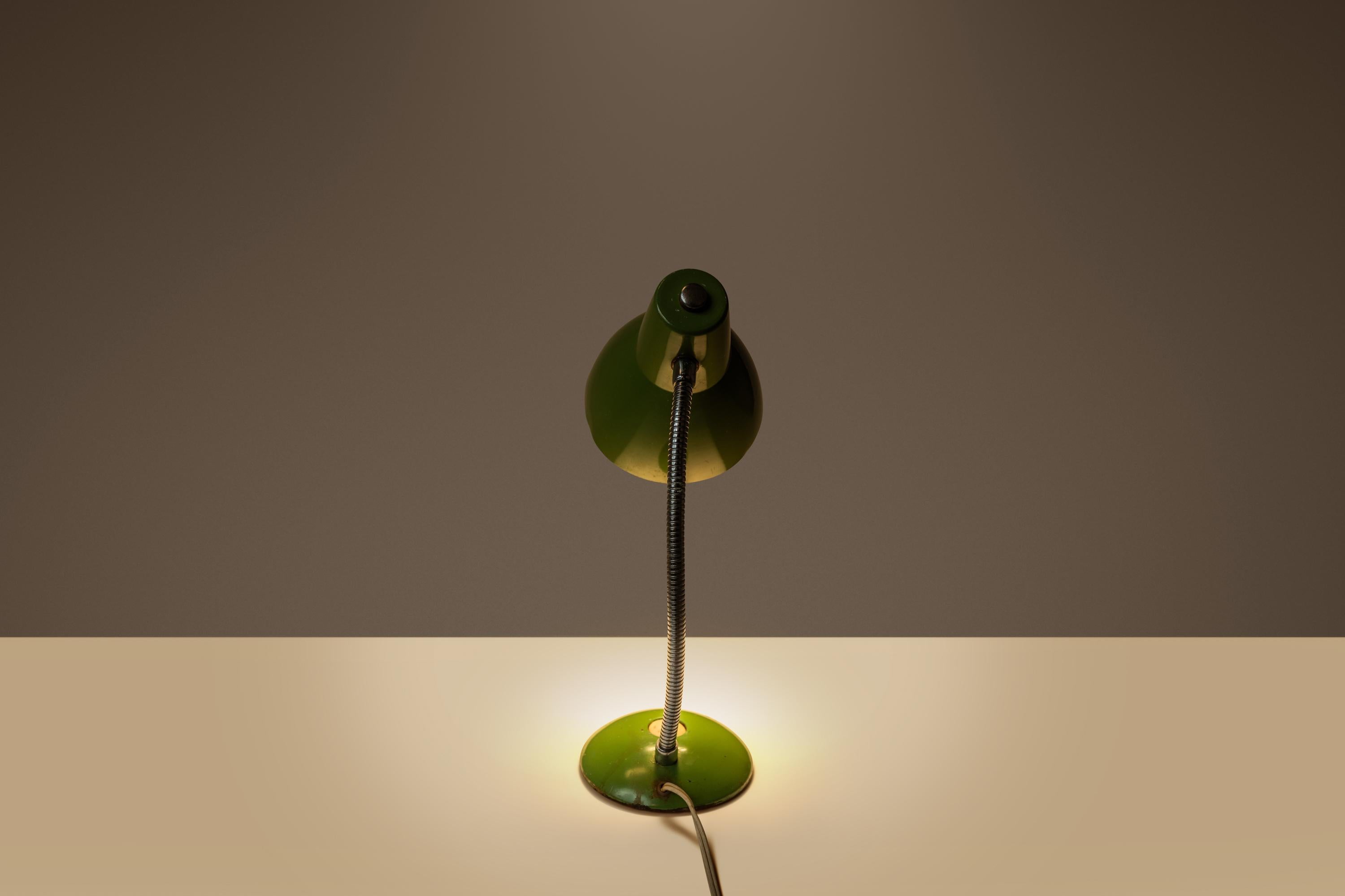 Introducing a splendidly patinaed Industrial desk lamp in a vintage army green paint scheme. Rich in character this little lamp adjusts to a max height of 18