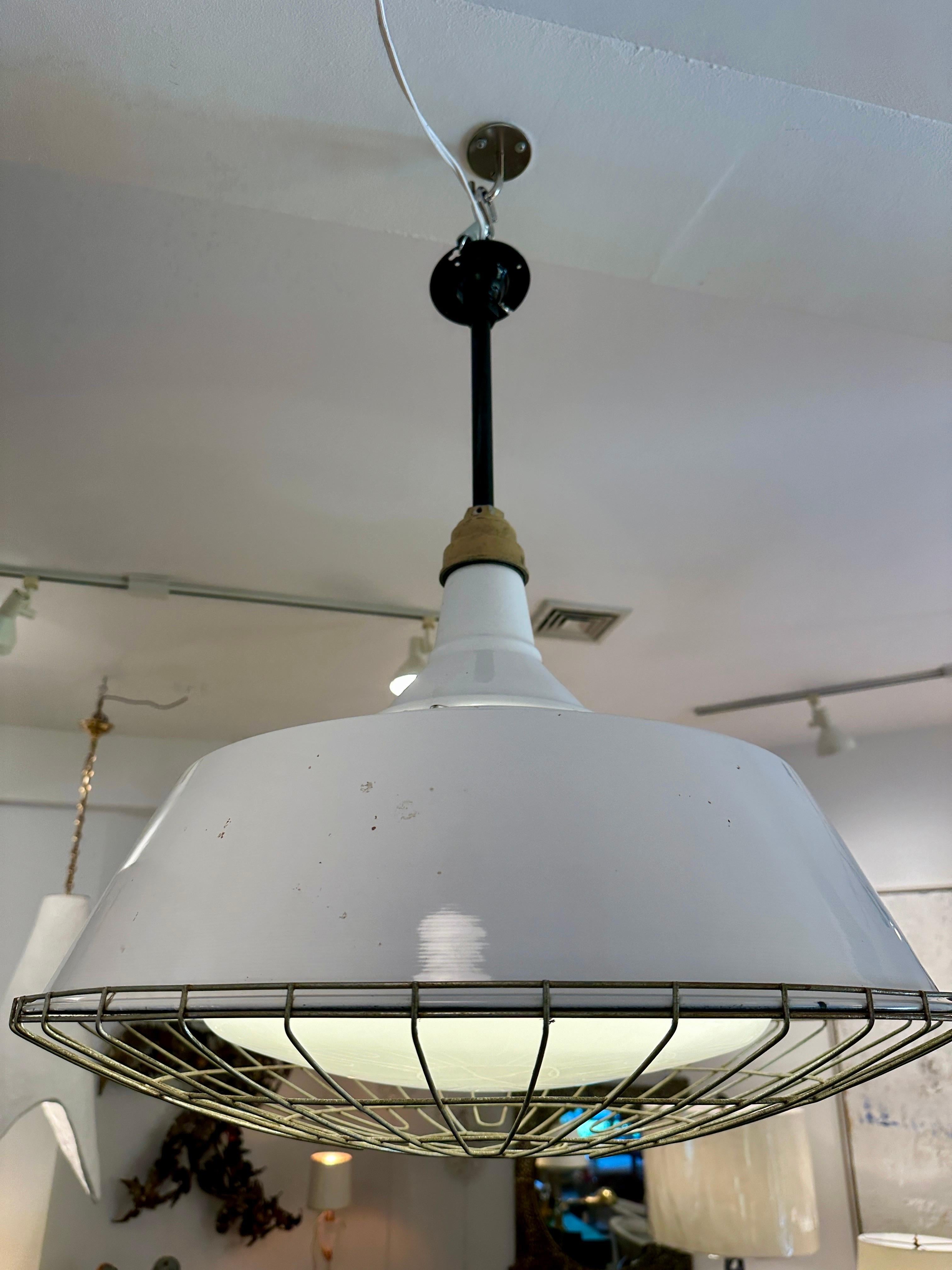 Industrial Pendant w/ Metal Cage Over Enamel and Milk Glass In Good Condition For Sale In North Miami, FL