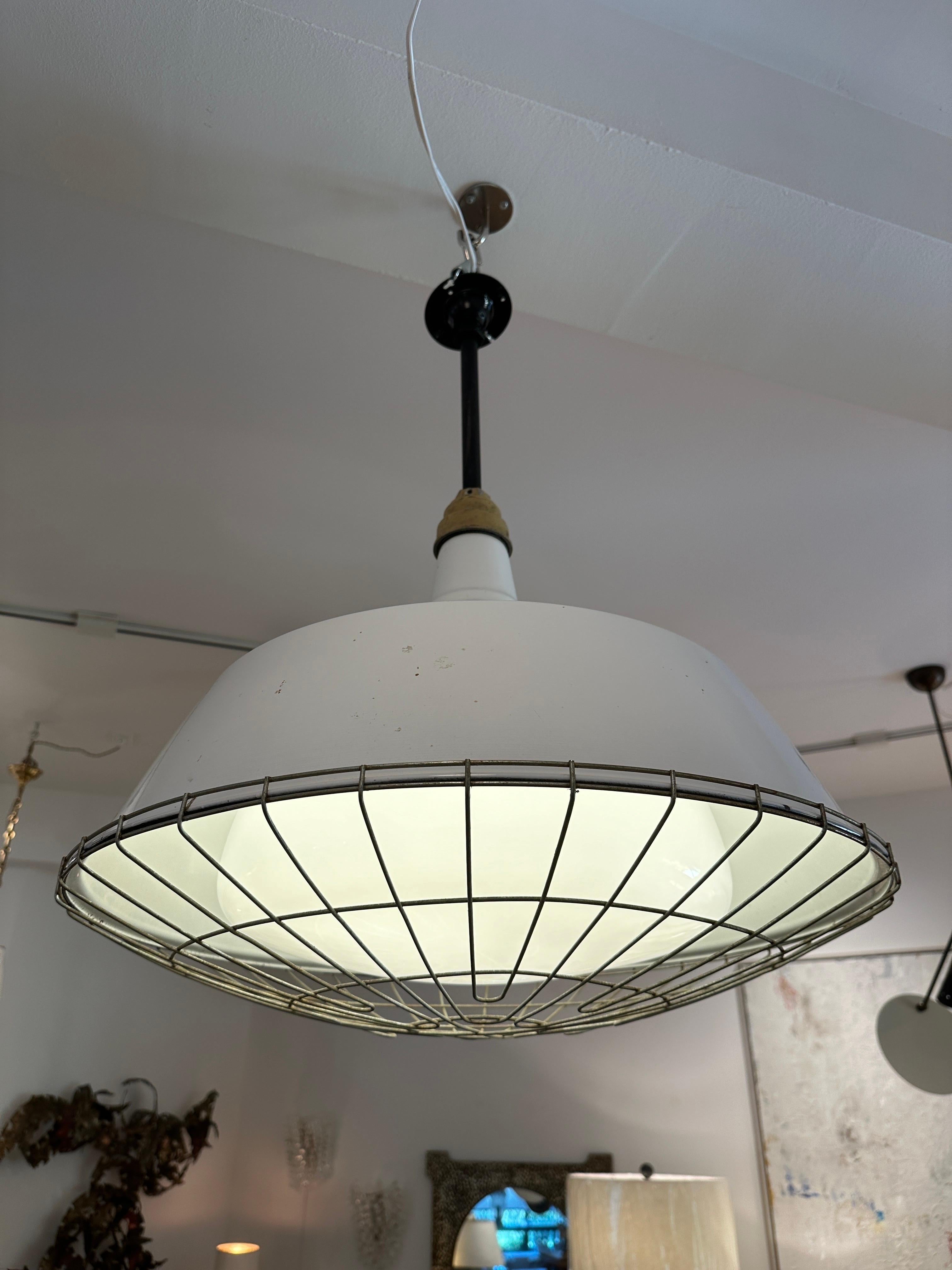 Mid-20th Century Industrial Pendant w/ Metal Cage Over Enamel and Milk Glass For Sale